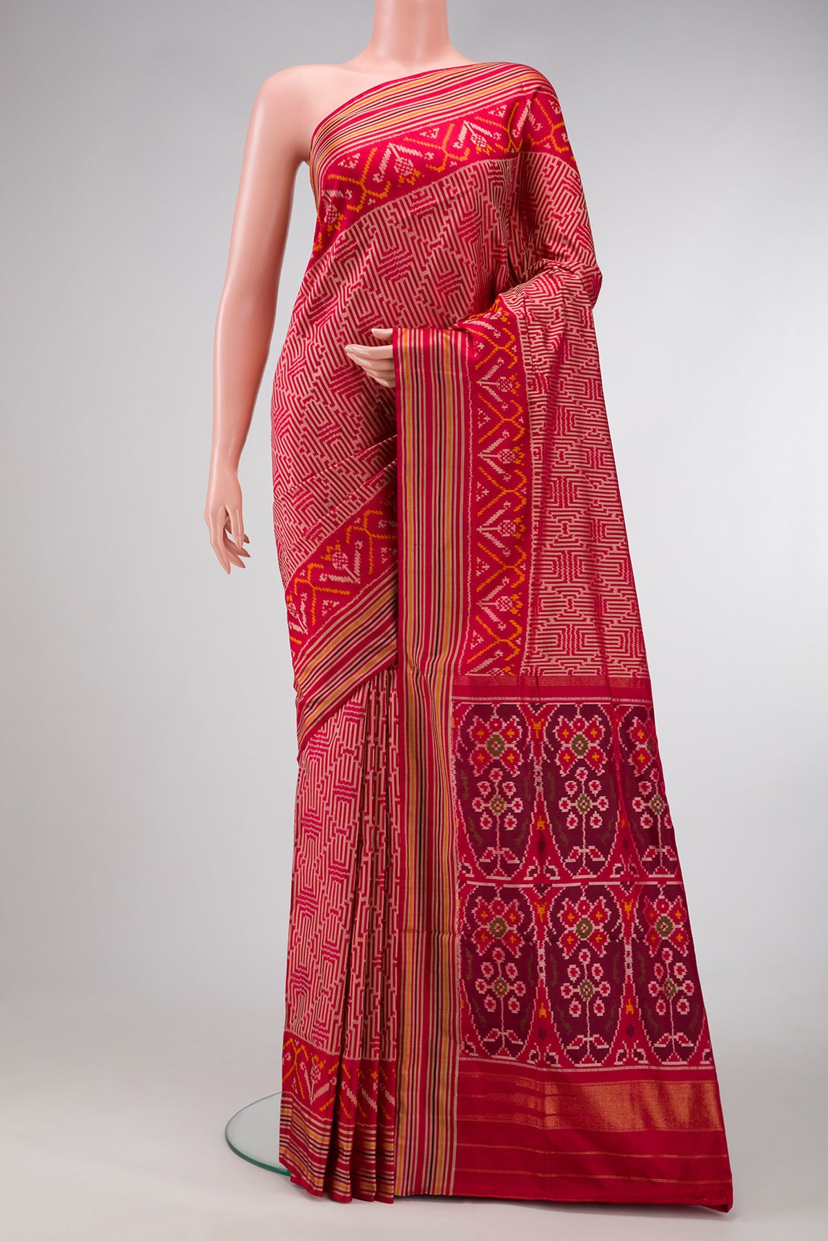 Maroon Dual Tone Double Ikat Saree with Ikat Print on the body and Thread Border.  displayed on a mannequin