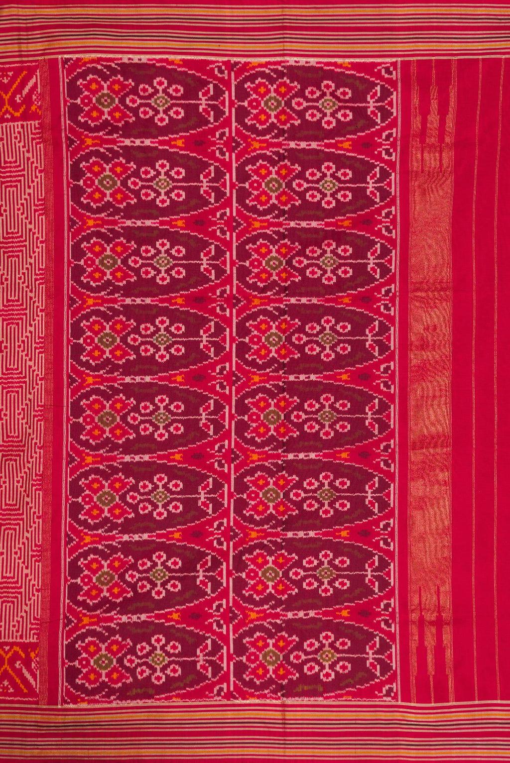 Close up image of the pallu of Maroon Dual Tone Double Ikat Saree with Ikat Print on the body and Thread Border. 