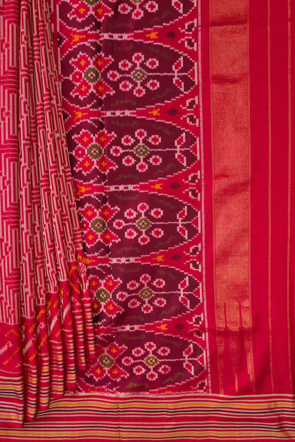 Pleats and pallu of Maroon Dual Tone Double Ikat Saree with Ikat Print on the body and Thread Border. 