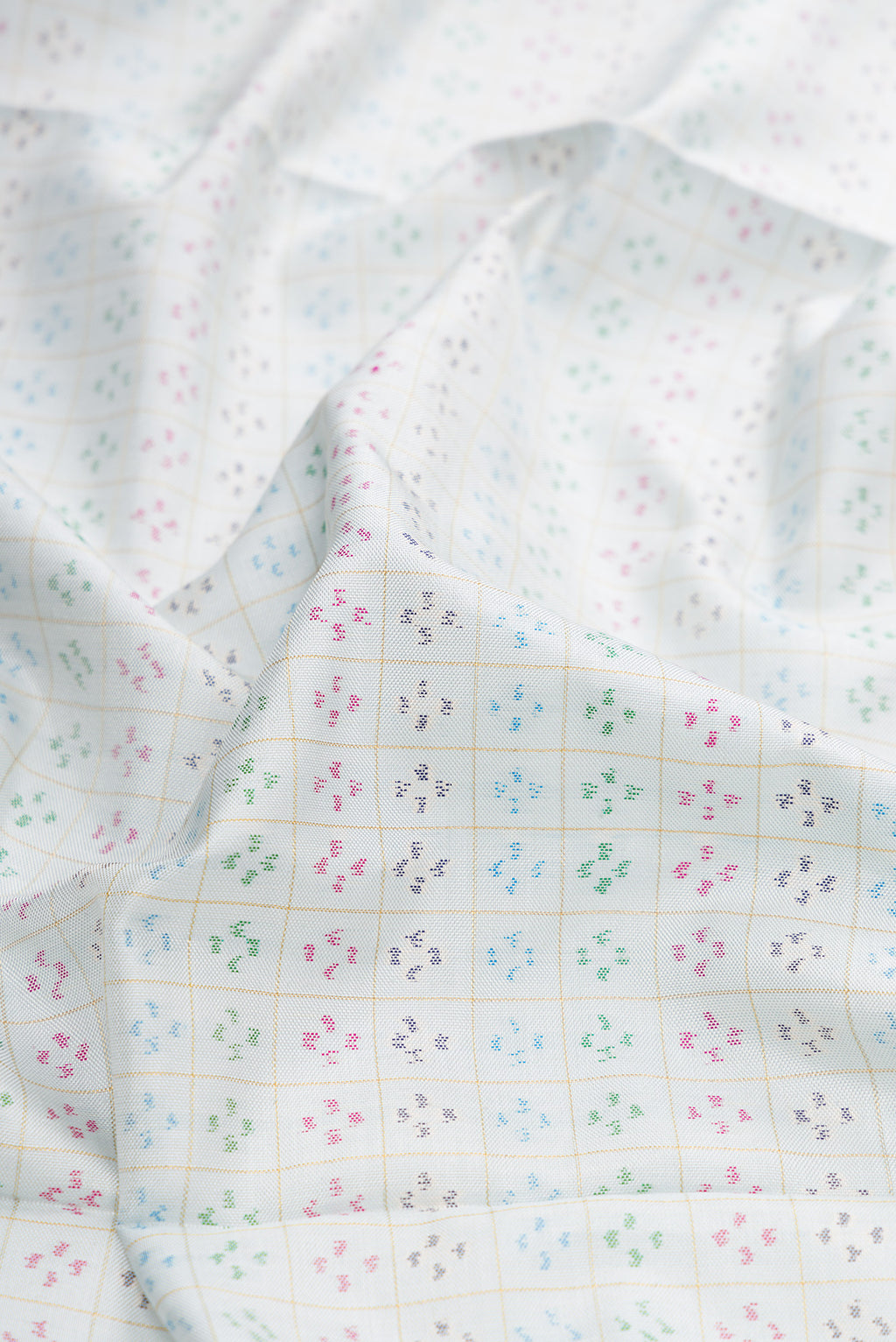 Close up of Light Blue Dual Tone Double Ikat Saree with Ikat Print on the body and Ikat Border.  displaying folds