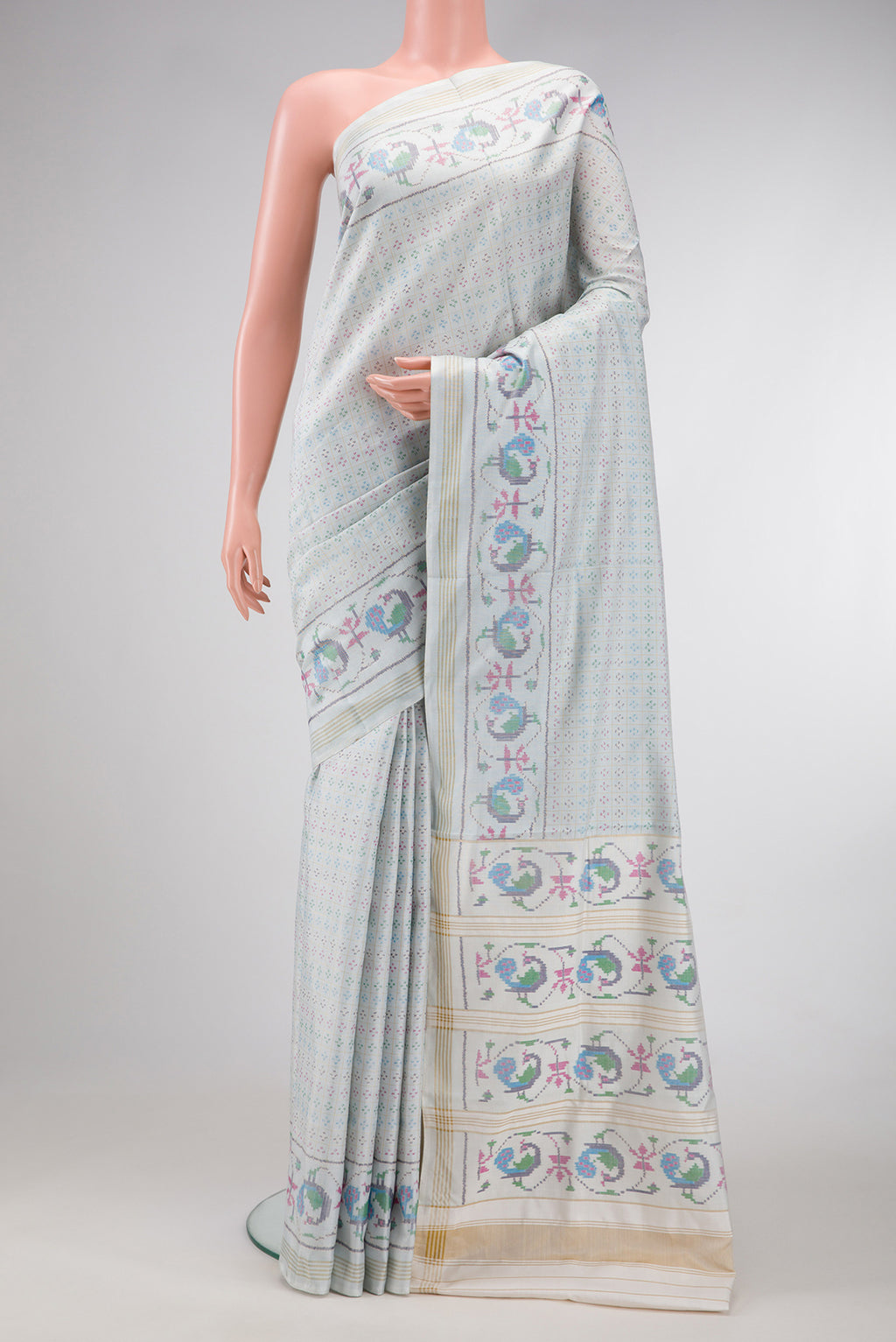 Light Blue Dual Tone Double Ikat Saree with Ikat Print on the body and Ikat Border.  displayed on a mannequin