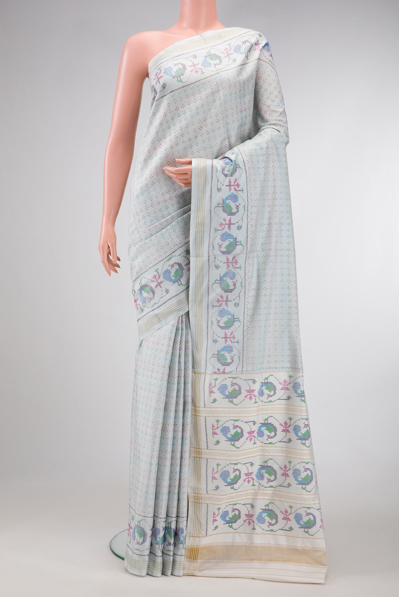 Light Blue Dual Tone Double Ikat Saree with Ikat Print on the body and Ikat Border.  displayed on a mannequin