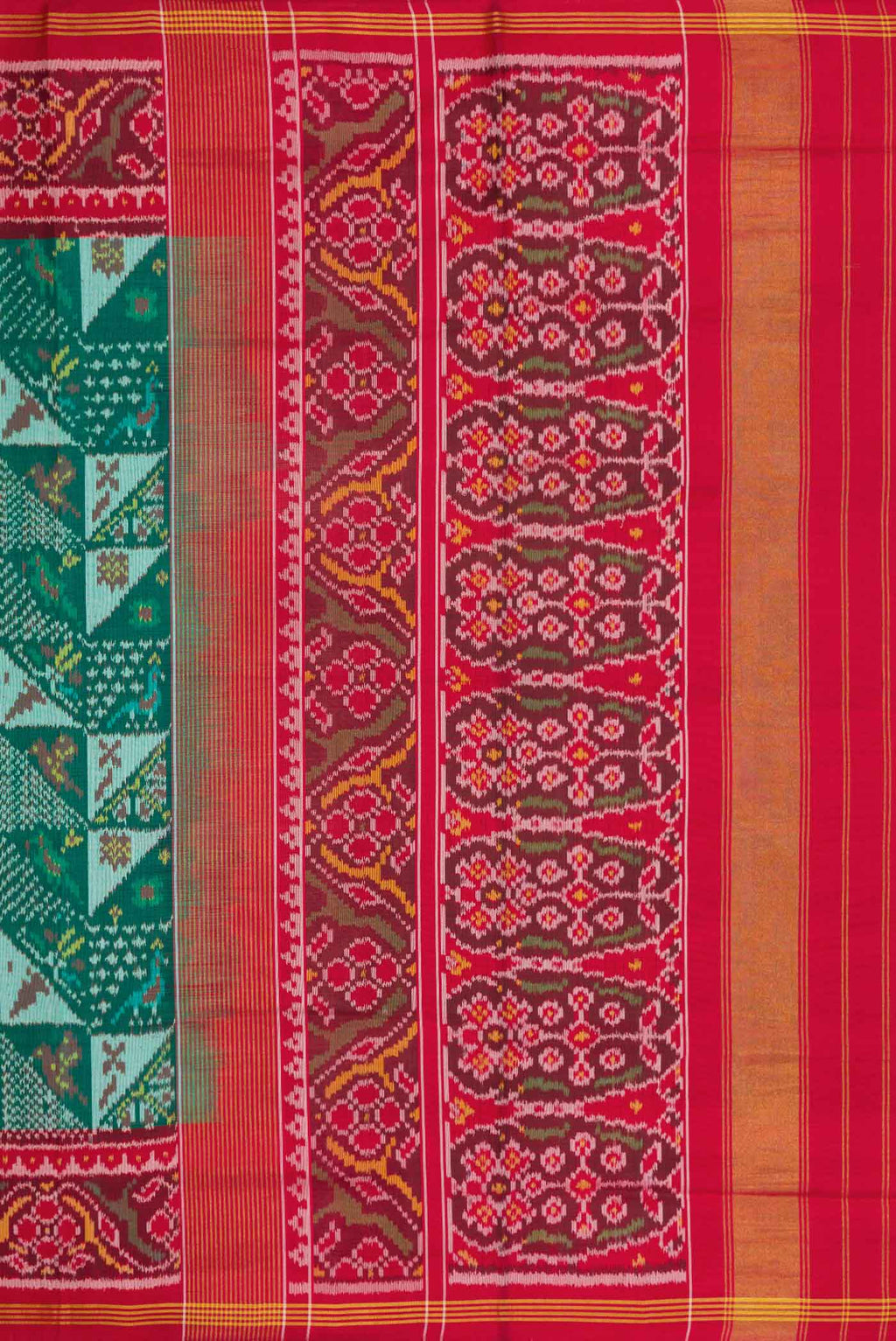 Close up image of the pallu of Green Dual Tone Rajkot Patola Silk Saree with Ikat Print on the body and Ikat Border