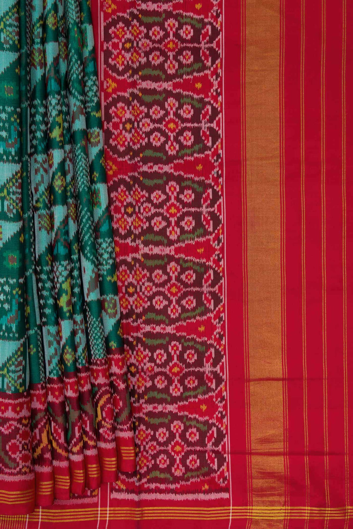 Pleats and pallu of Green Dual Tone Rajkot Patola Silk Saree with Ikat Print on the body and Ikat Border