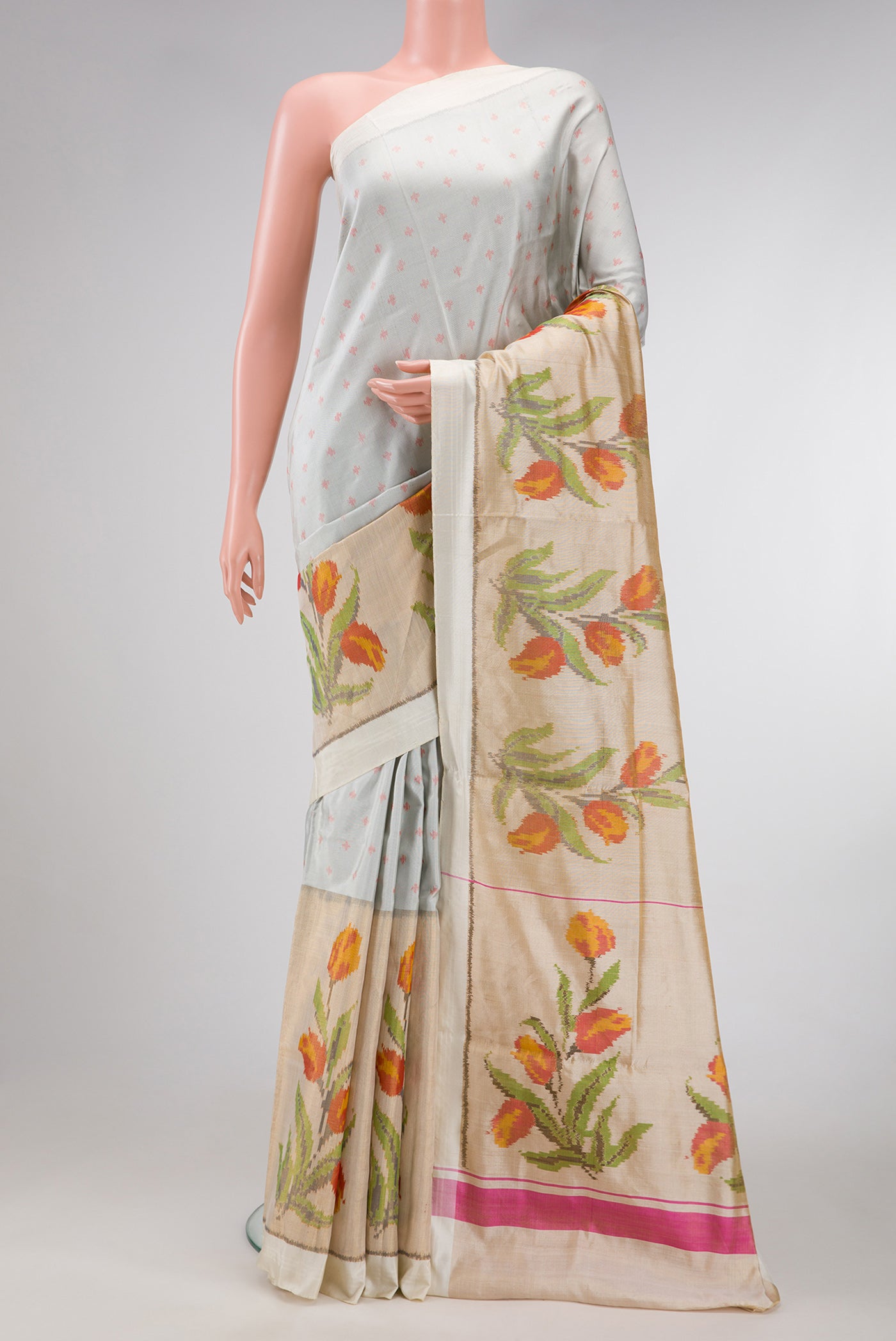 Grey Dual Tone Kanjivaram Silk Saree with Ikat Print on the body and Ikat Border.  displayed on a mannequin