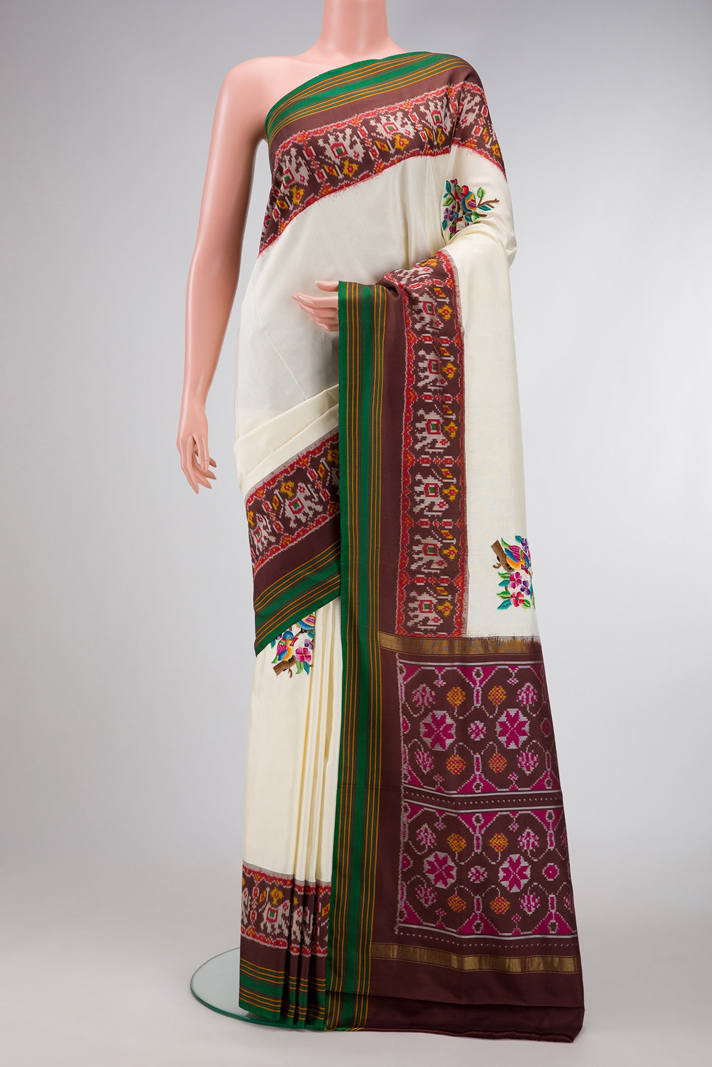 Off White Dual Tone Double Ikat Saree with Embroidery on the body and Ikat Border.  displayed on a mannequin