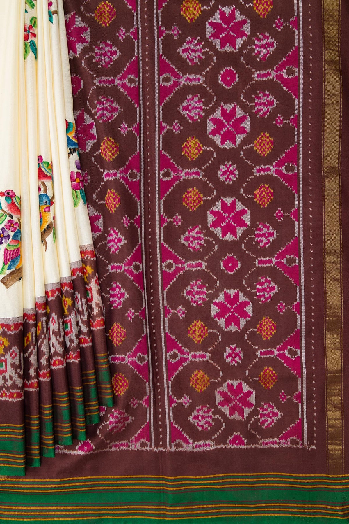 Pleats and pallu of Off White Dual Tone Double Ikat Saree with Embroidery on the body and Ikat Border. 