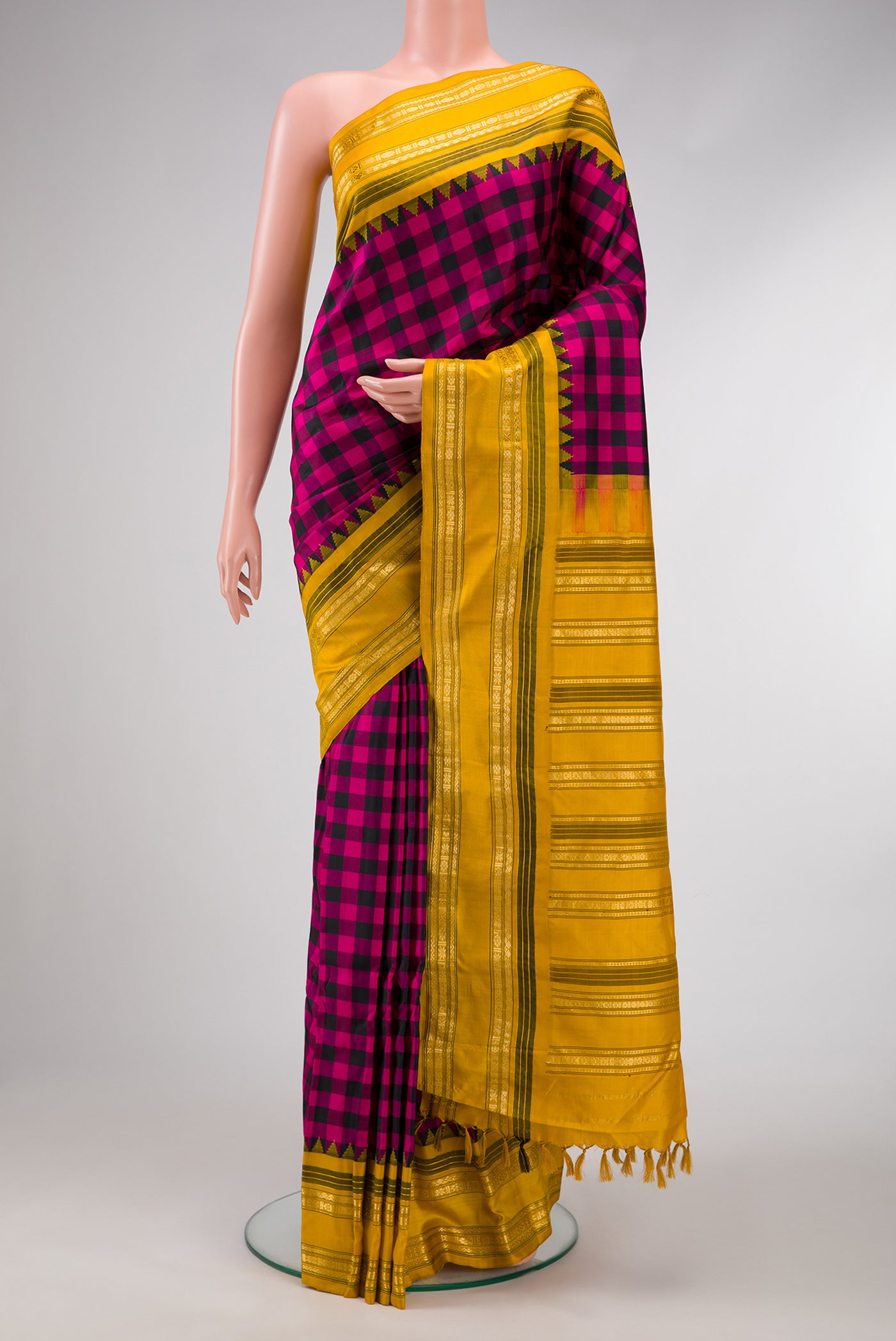 Black and Pink Color Gadwal Silk Saree with Checked design on the body and Temple Border.  displayed on a mannequin