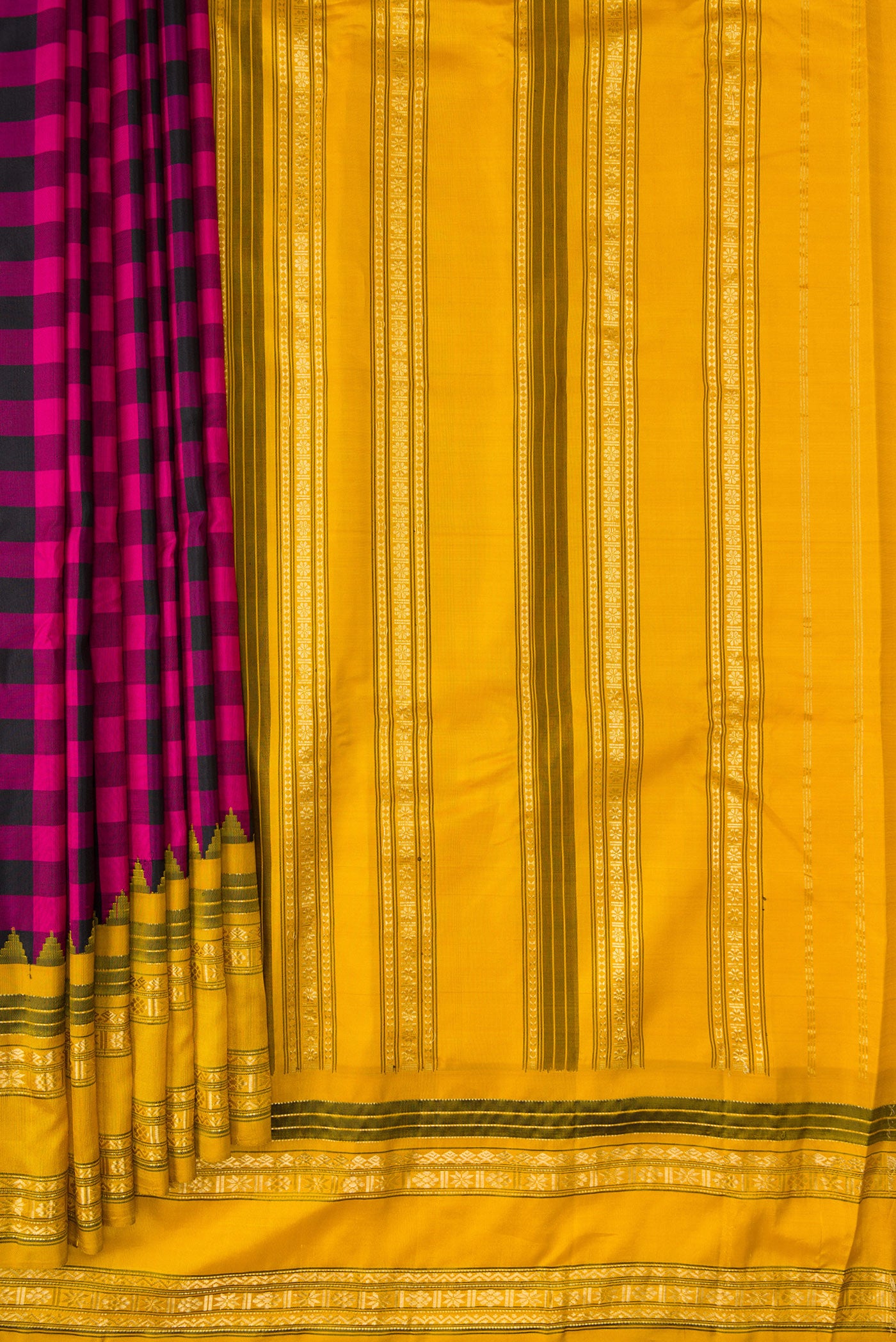 Pleats and pallu of Black and Pink Color Gadwal Silk Saree with Checked design on the body and Temple Border. 