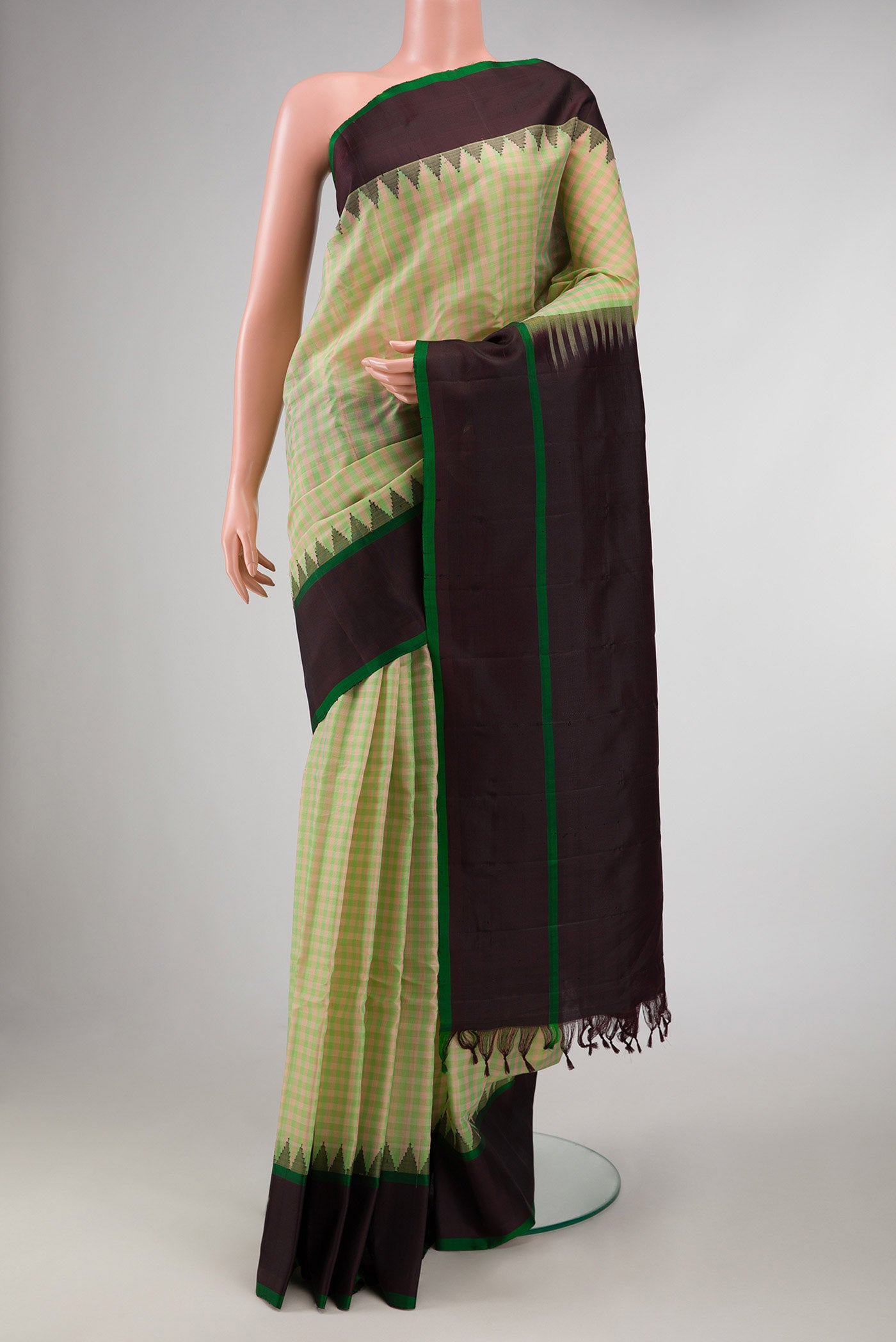 Green and Pink Color Gadwal Silk Saree with Checked design on the body and Thread Border displayed on a mannequin