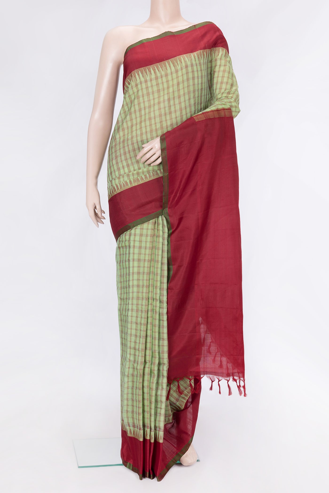 Pista Green Dual Tone Gadwal Silk Saree with Checked design on the body and Plain Border.  displayed on a mannequin