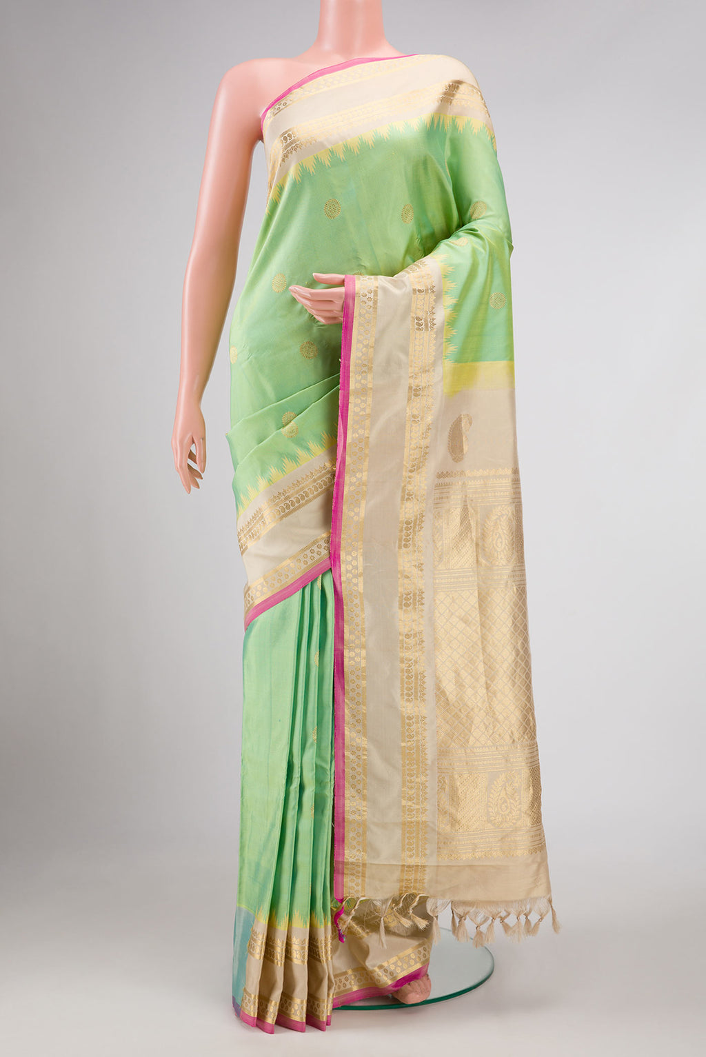 Pista Green Dual Tone Gadwal Silk Saree with Zari Butta on the body and Zari Border displayed on a mannequin