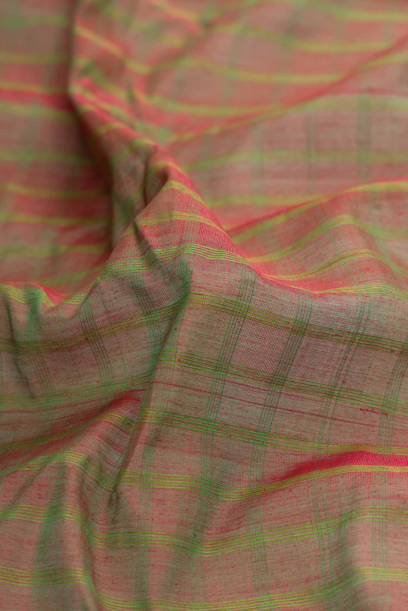 Close up of Green Dual Tone Gadwal Silk Saree with Checked design on the body and Zari Border displaying folds