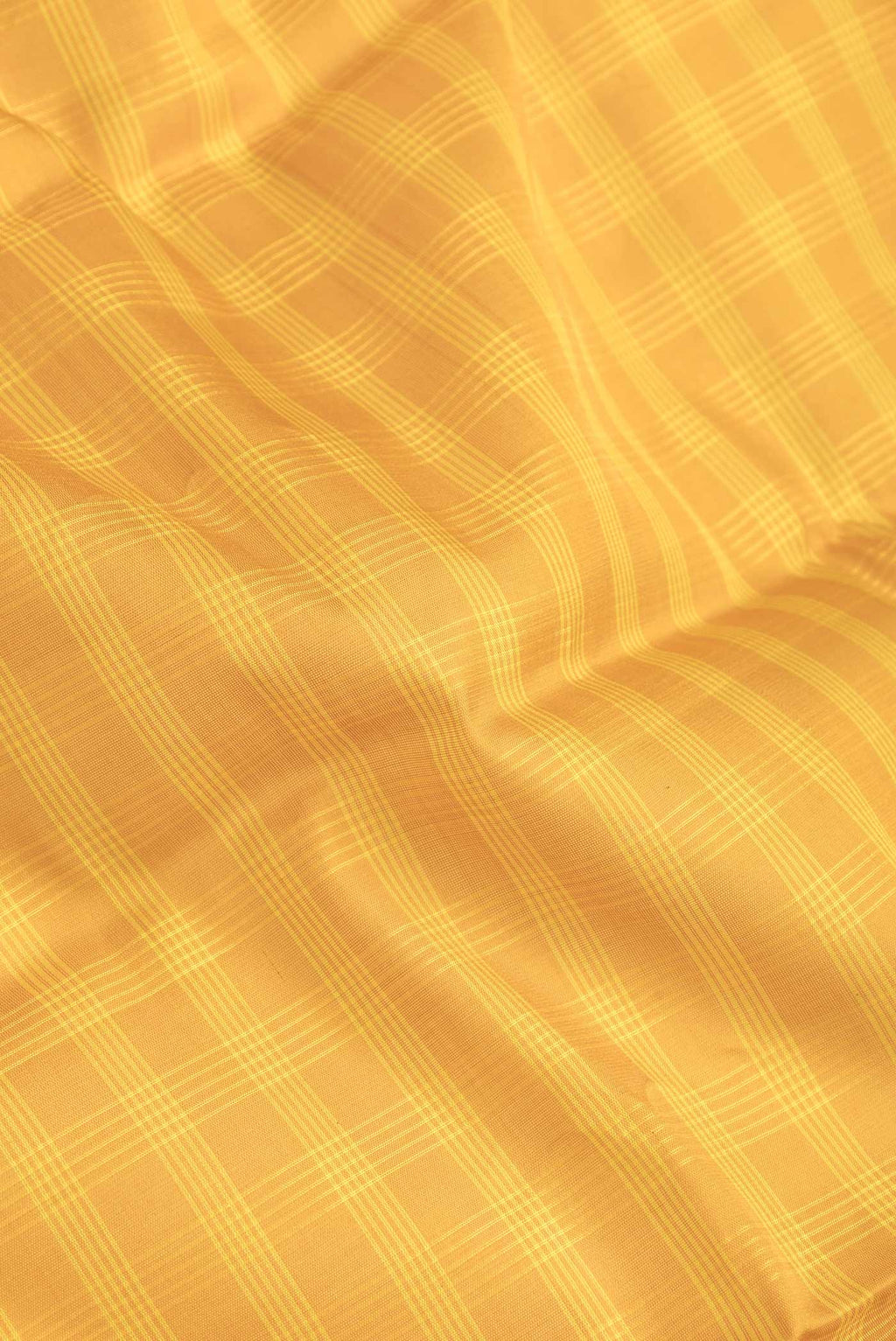 Close up of Yellow Dual Tone Gadwal Silk Saree with Checked design on the body and Zari Border.  displaying folds