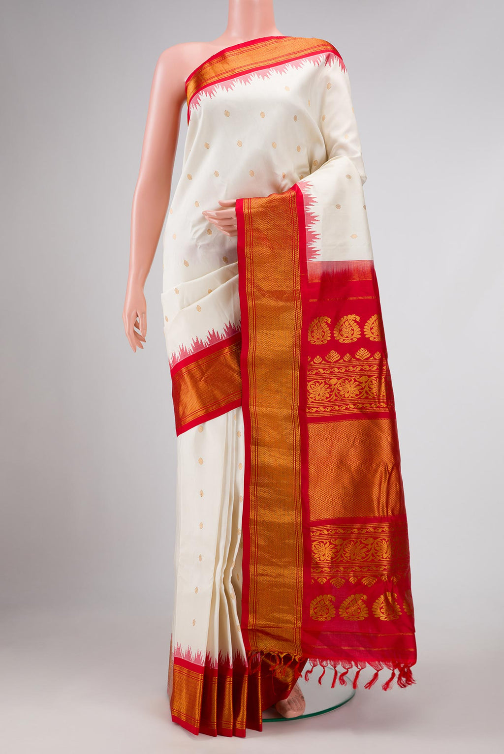 Off White Dual Tone Gadwal Silk Saree with Zari Butta on the body and Zari Border displayed on a mannequin