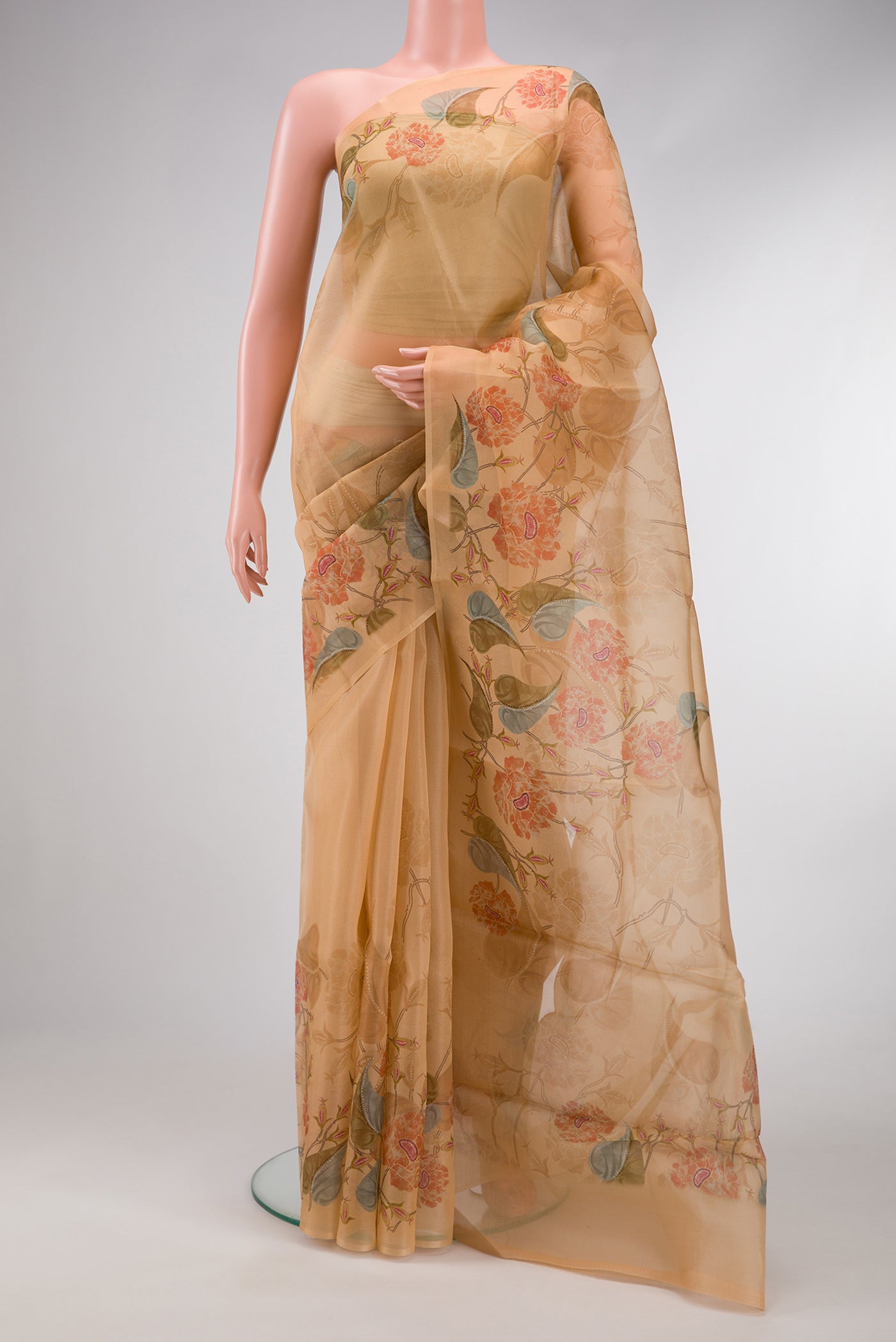 Golden Peach Dual Tone Organza Silk Saree with Printed design on the body and Zari Border.  displayed on a mannequin