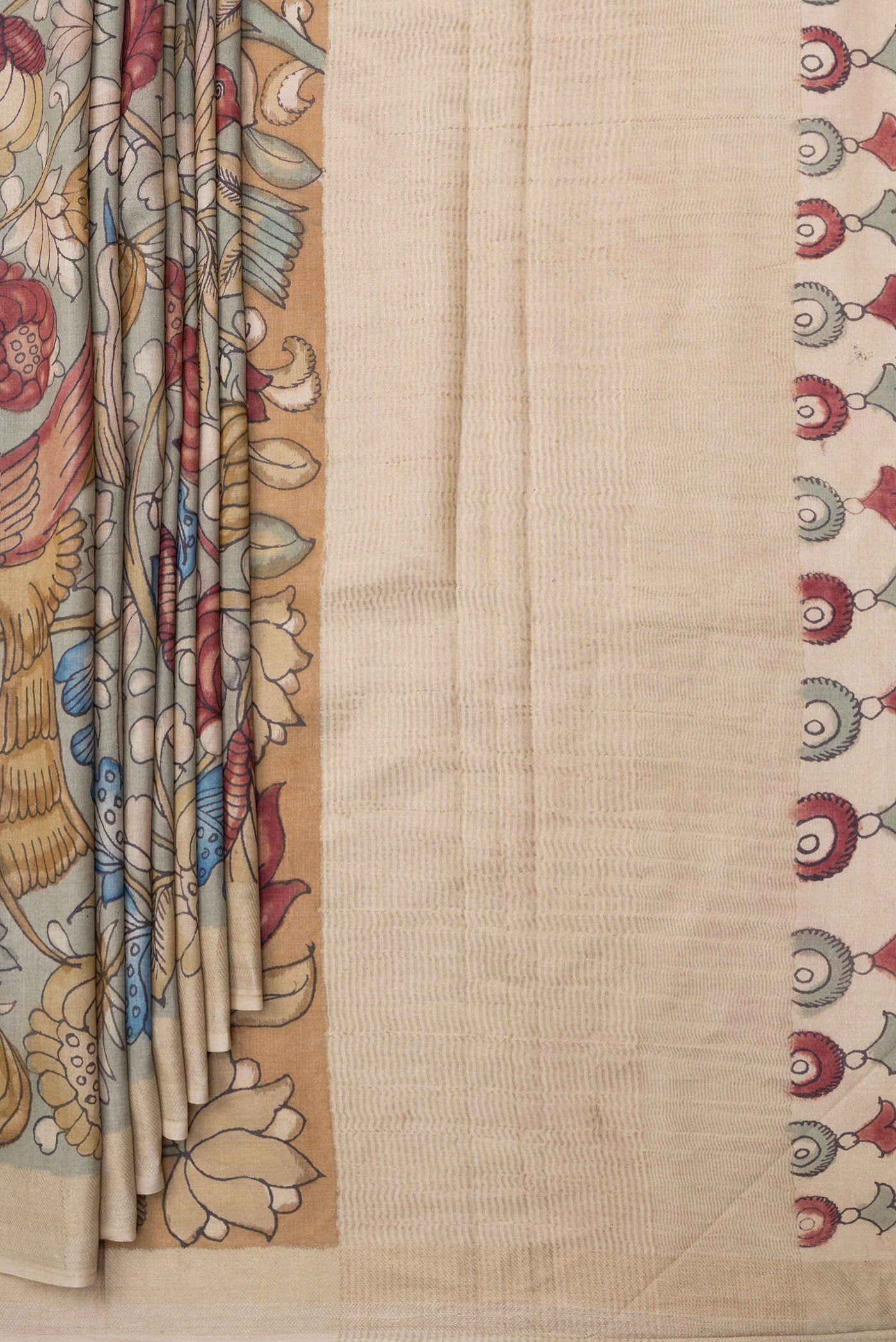 Pleats and pallu of Green Tussar Silk Saree with kalamkari Print on the body and Zari Border. 