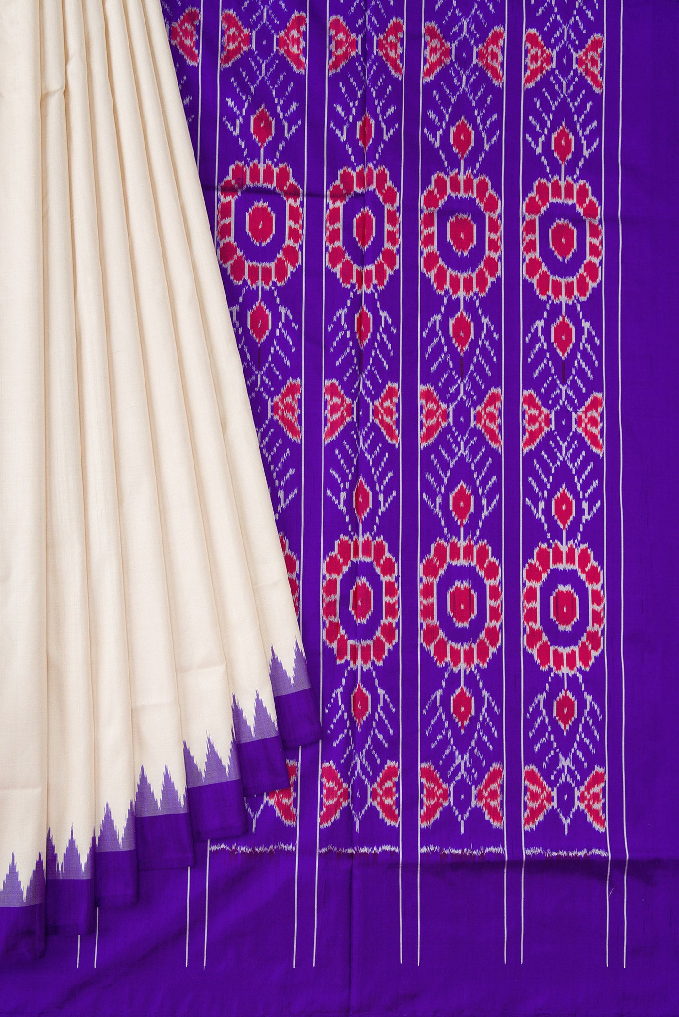 Pleats and pallu of Off White Double Ikat Saree with Plain Body and Ikat Border. 