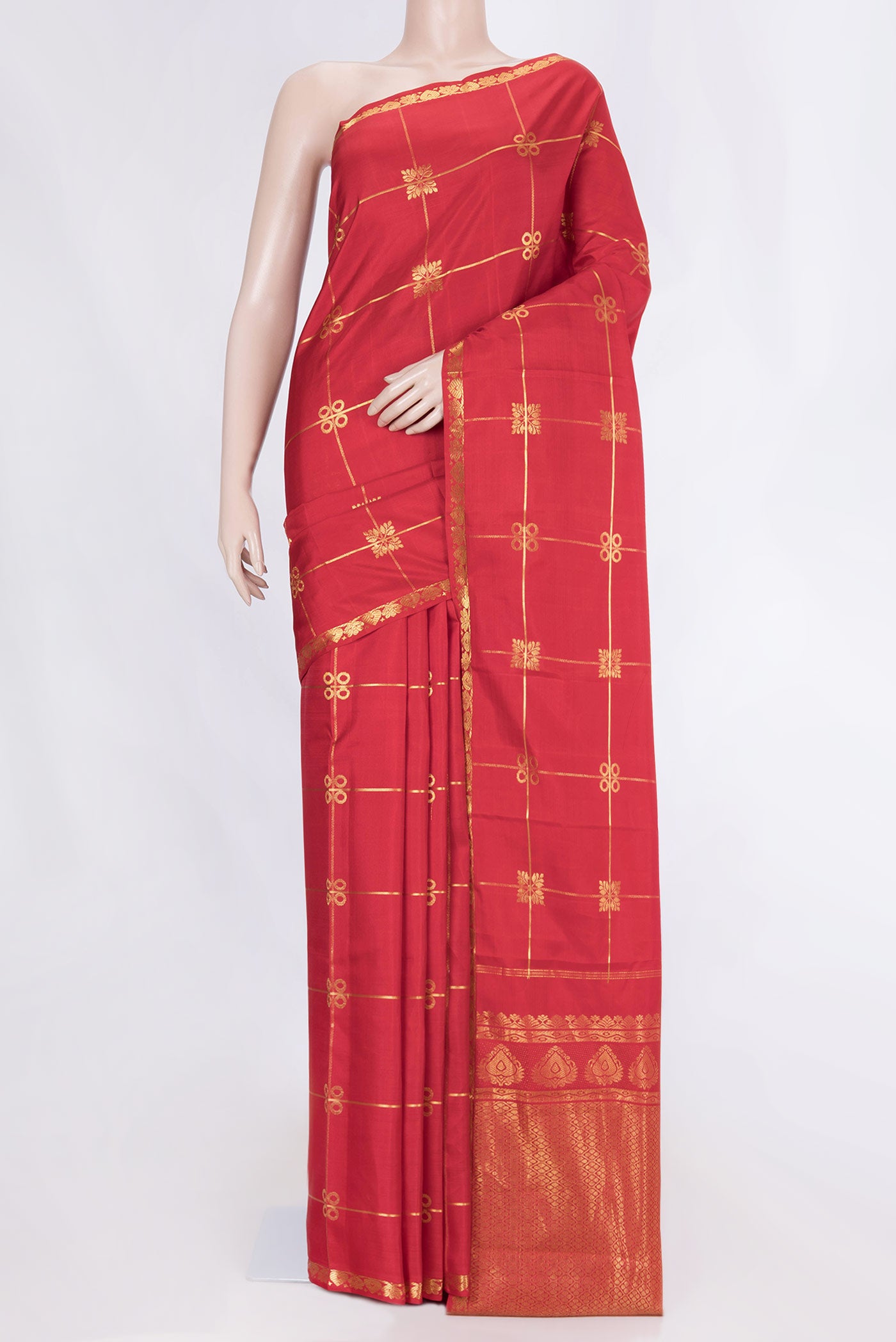 Red Dual Tone Kanchipuram Silk Saree with Checked design on the body and Zari Border displayed on a mannequin