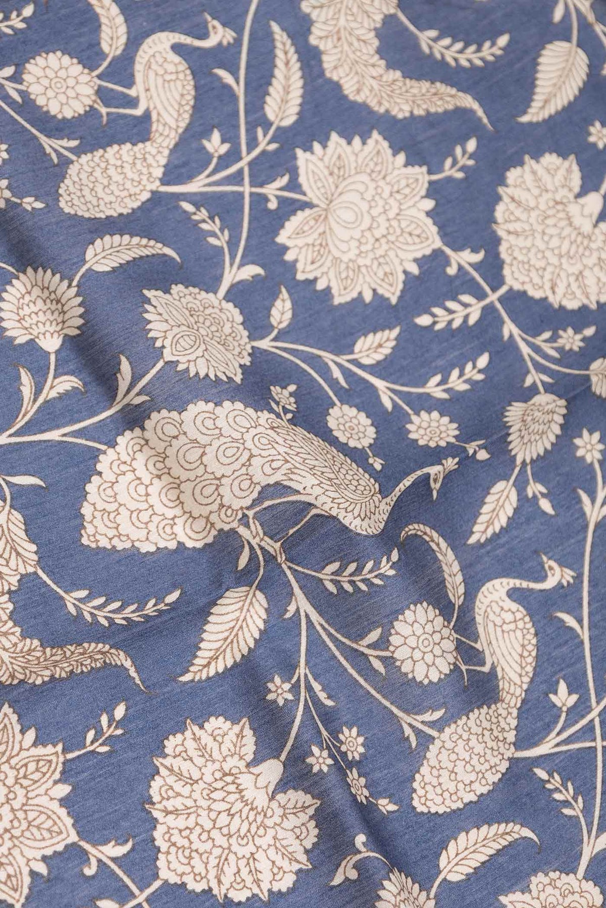 Close up of Navy Blue Dual Tone Tussar Silk Saree with Printed design on the body and Zari Border displaying folds