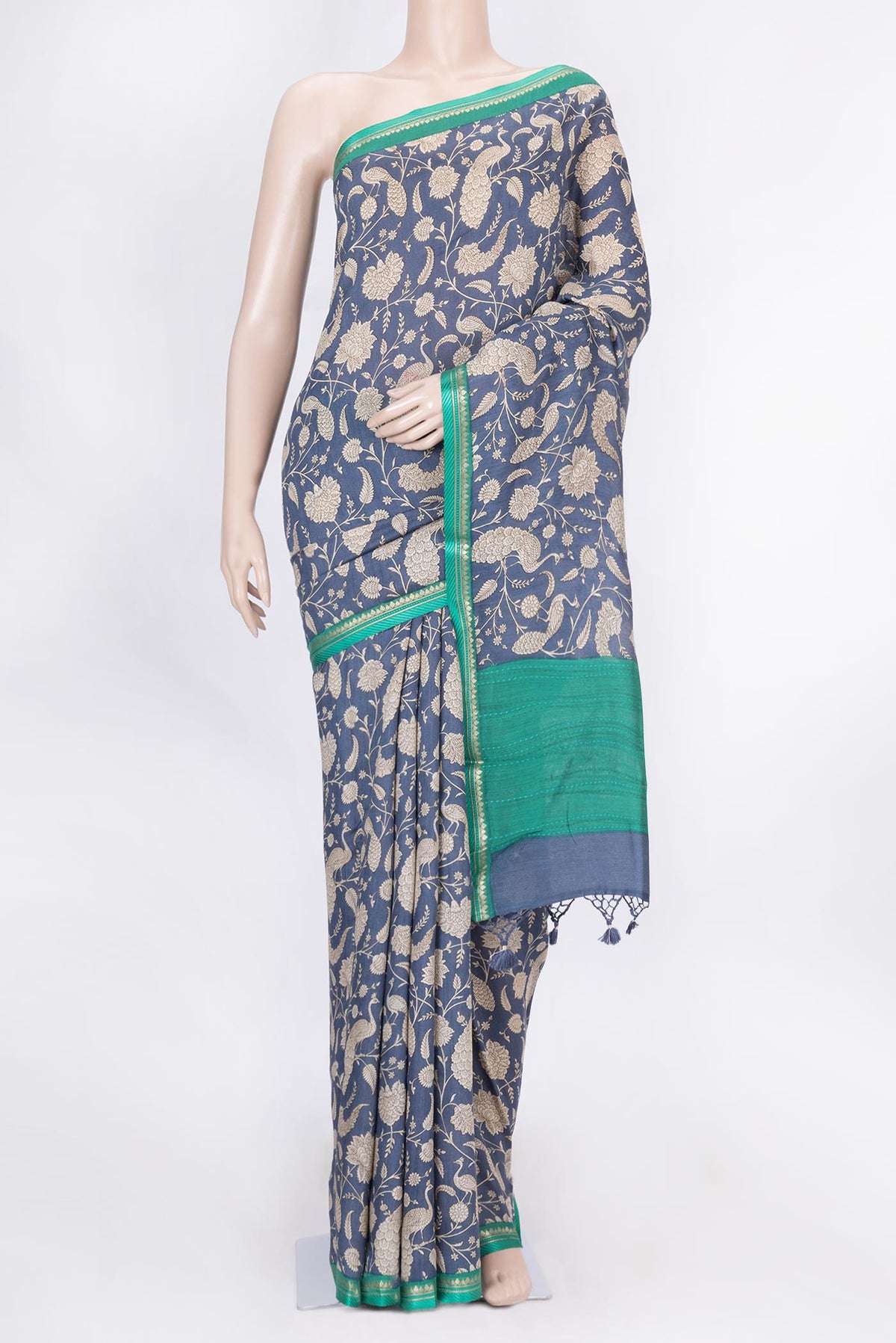 Navy Blue Dual Tone Tussar Silk Saree with Printed design on the body and Zari Border displayed on a mannequin