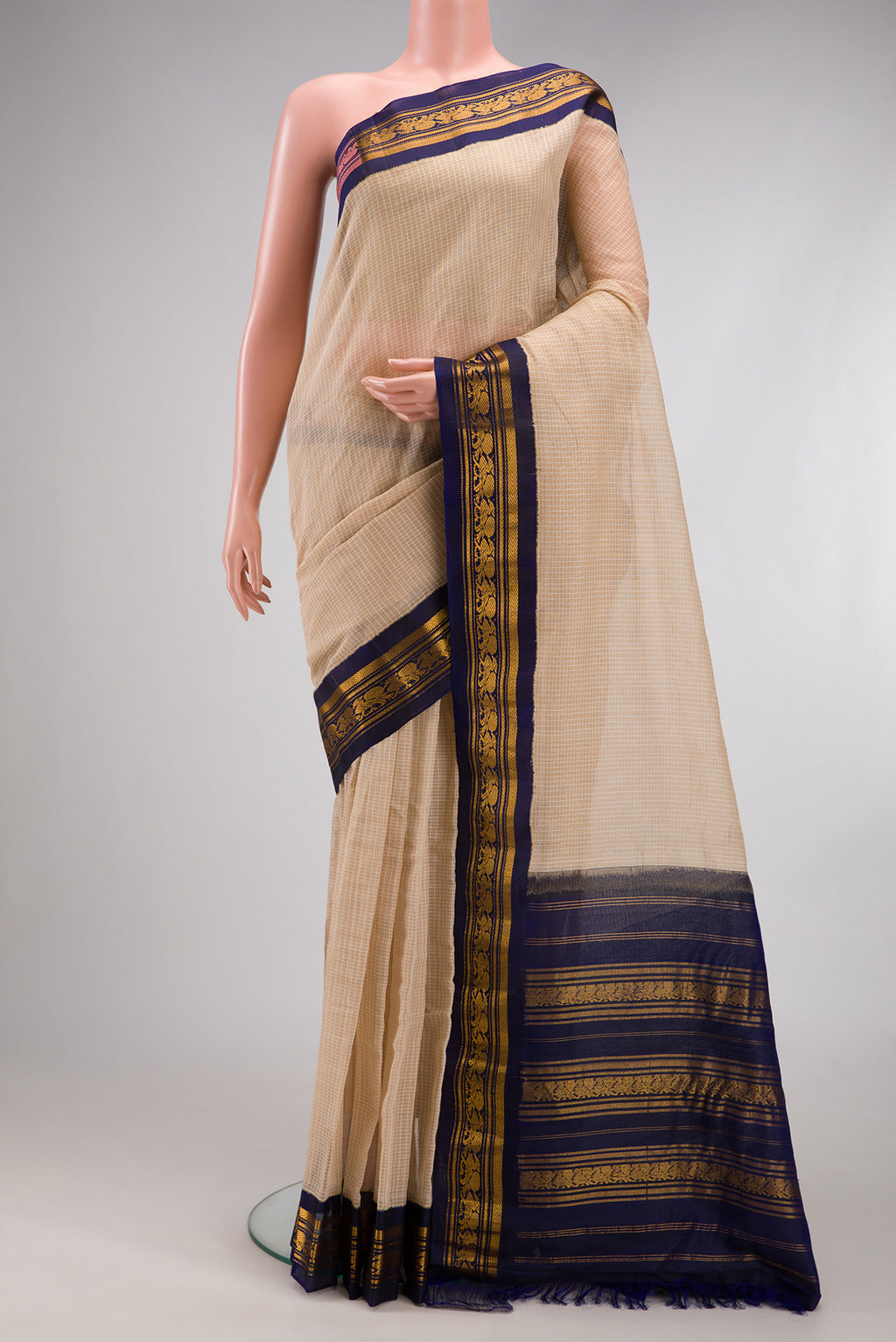 Beige Gadwal cotton Saree with Checked design on the body and Silk Border.  displayed on a mannequin