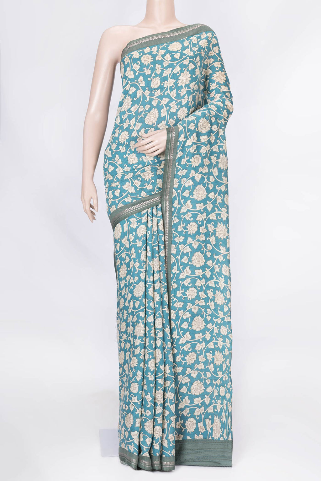Blue Dual Tone Tussar Saree with Printed design on the body and Zari Border displayed on a mannequin