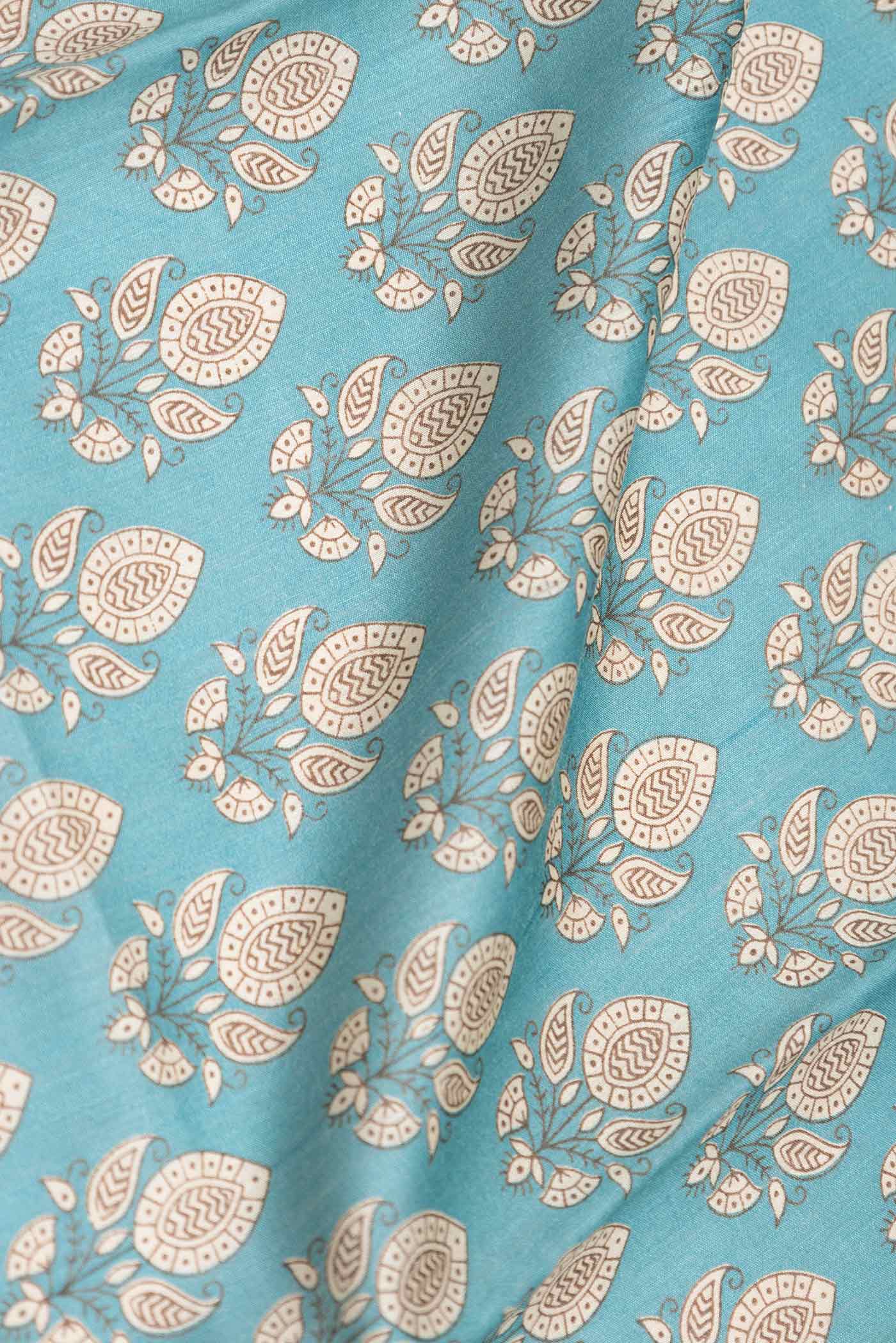 Close up of Sea Green Dual Tone Tussar Silk Saree with Printed design on the body and Zari Border displaying folds