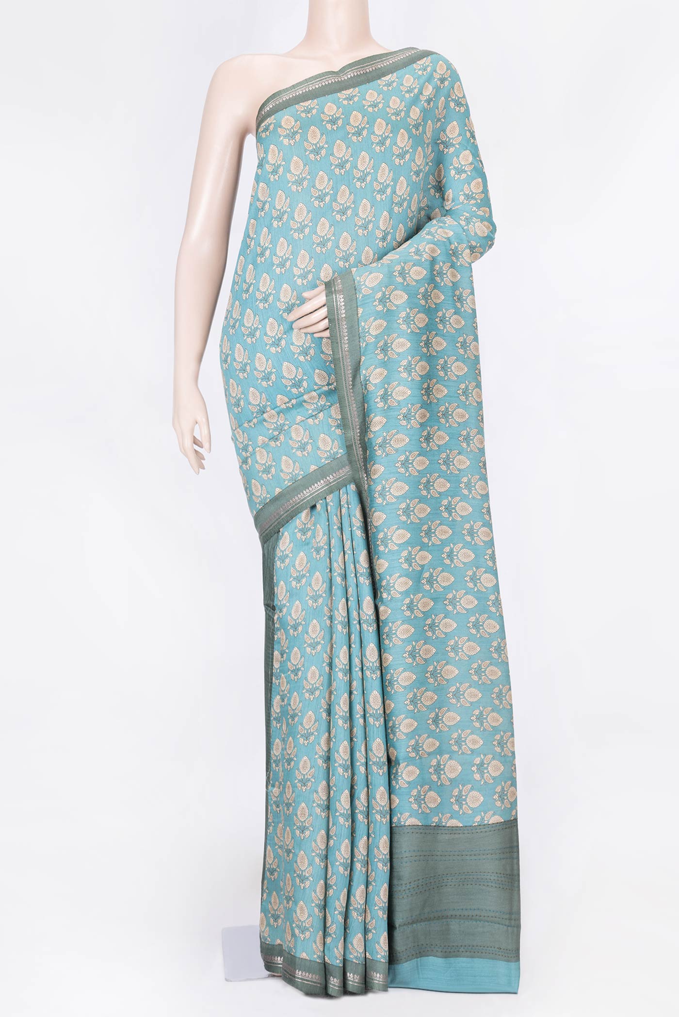 Sea Green Dual Tone Tussar Silk Saree with Printed design on the body and Zari Border displayed on a mannequin