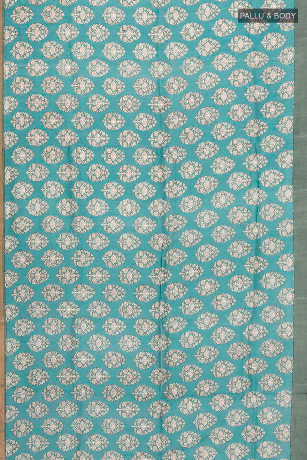 Flat view of Green Tussar Silk Saree with Printed design on the body and Zari Border