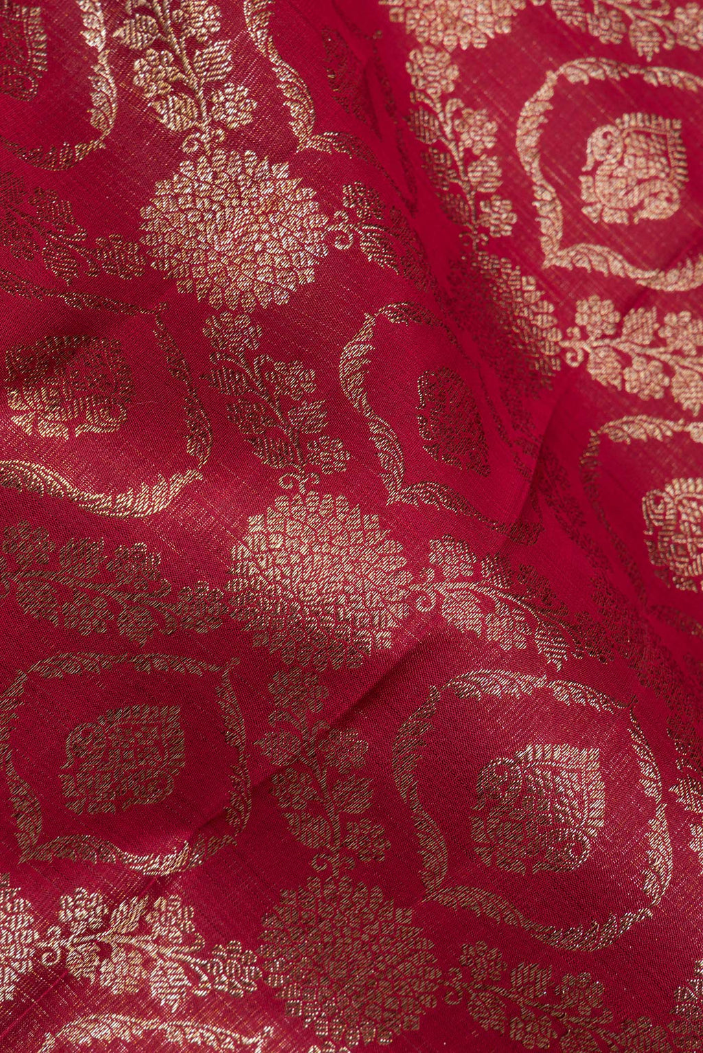 Close up of Pure Silk Maroon Kanchipuram Saree with Zari Brocade on the body and Zari Border.  displaying folds