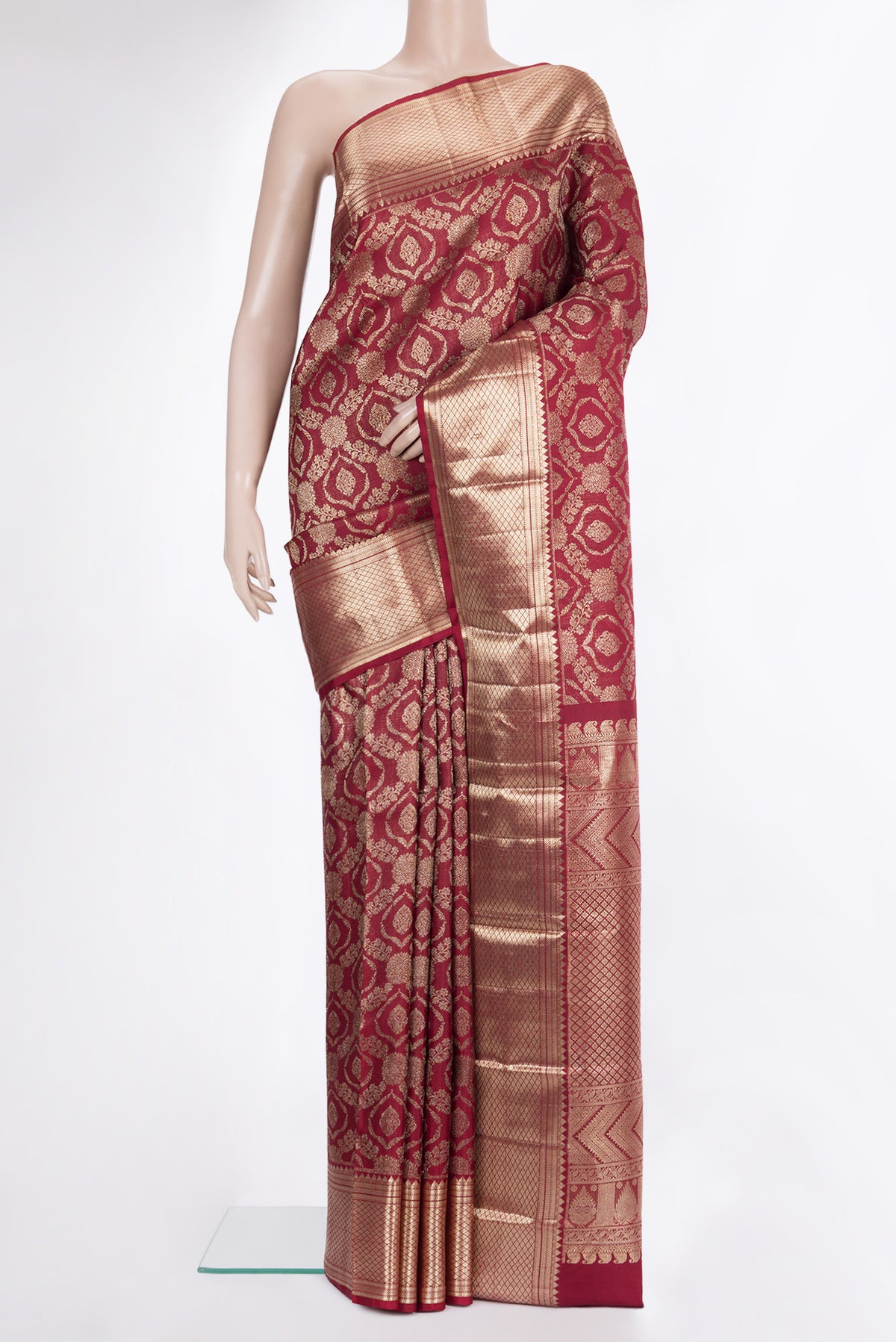 Pure Silk Maroon Kanchipuram Saree with Zari Brocade on the body and Zari Border.  displayed on a mannequin