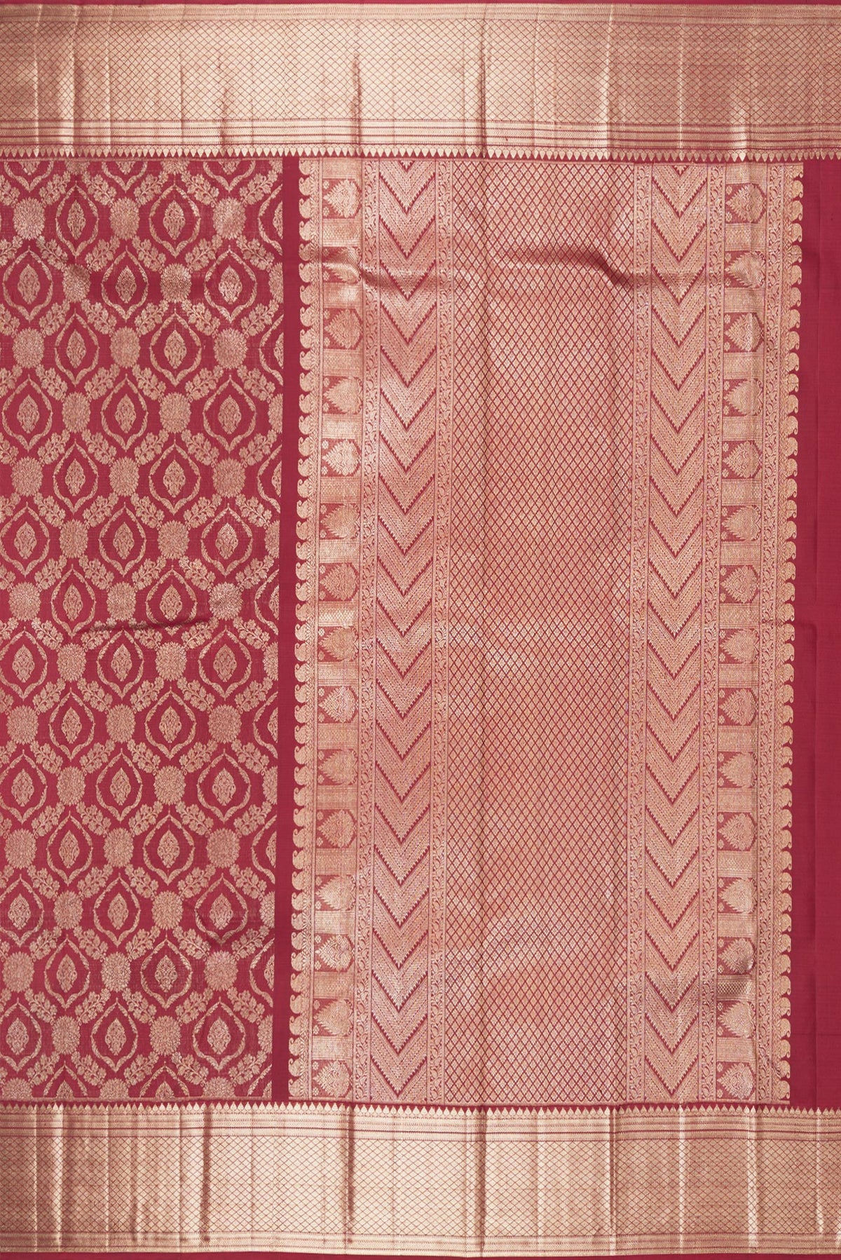 Close up image of the pallu of Pure Silk Maroon Kanchipuram Saree with Zari Brocade on the body and Zari Border. 