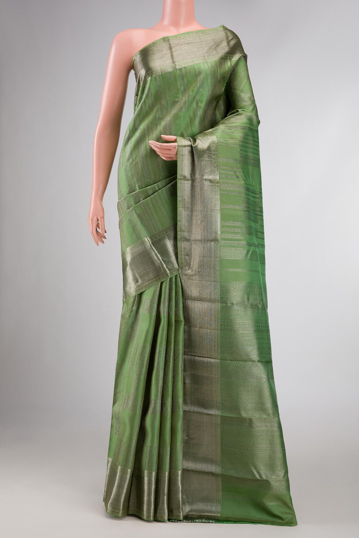Green Dual Tone Kanchipuram Silk Saree with Zari Brocade on the body and Zari Border displayed on a mannequin