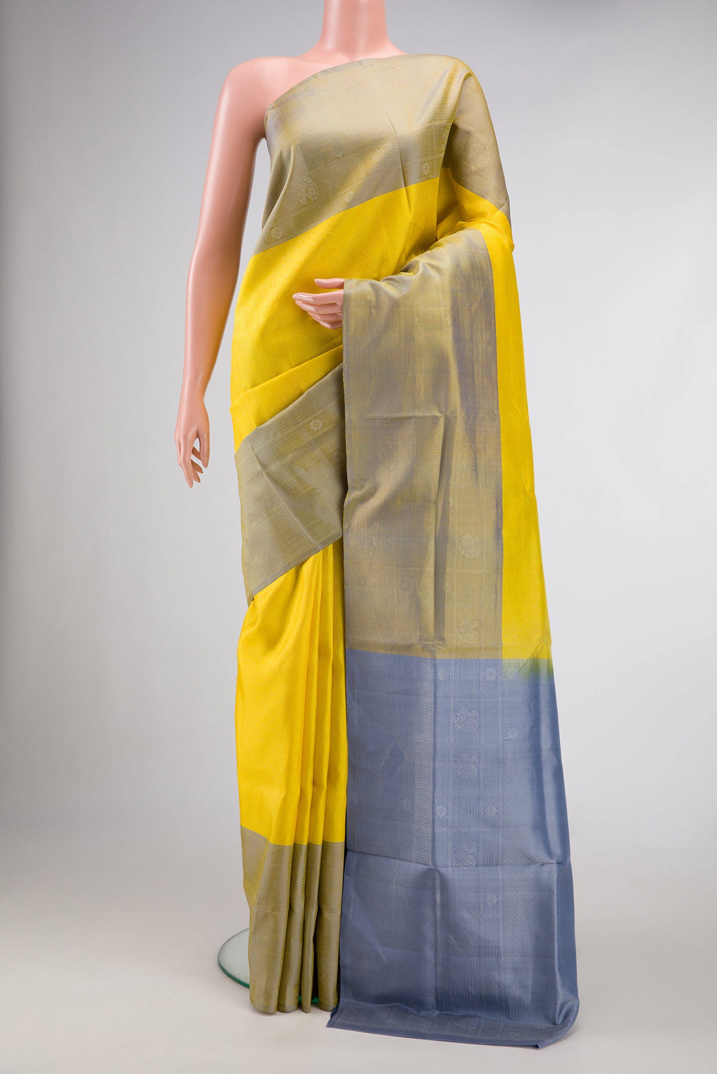 Yellow Dual Tone Soft Silk Saree with Zari Brocade on the body and Zari Border.  displayed on a mannequin