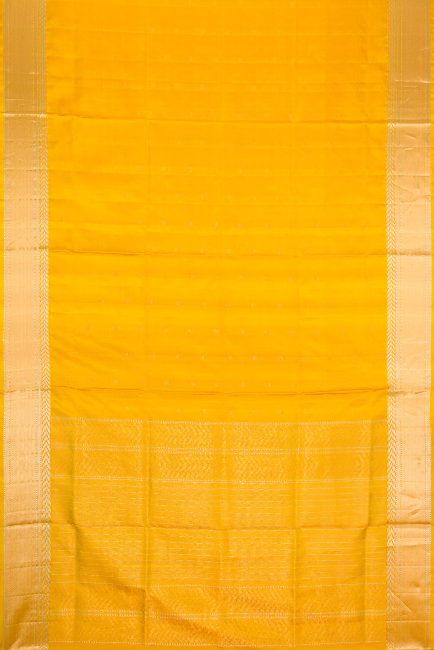 Flat view of Mustard Dual Tone Soft Silk Saree with Zari Butta on the body and Zari Border. 