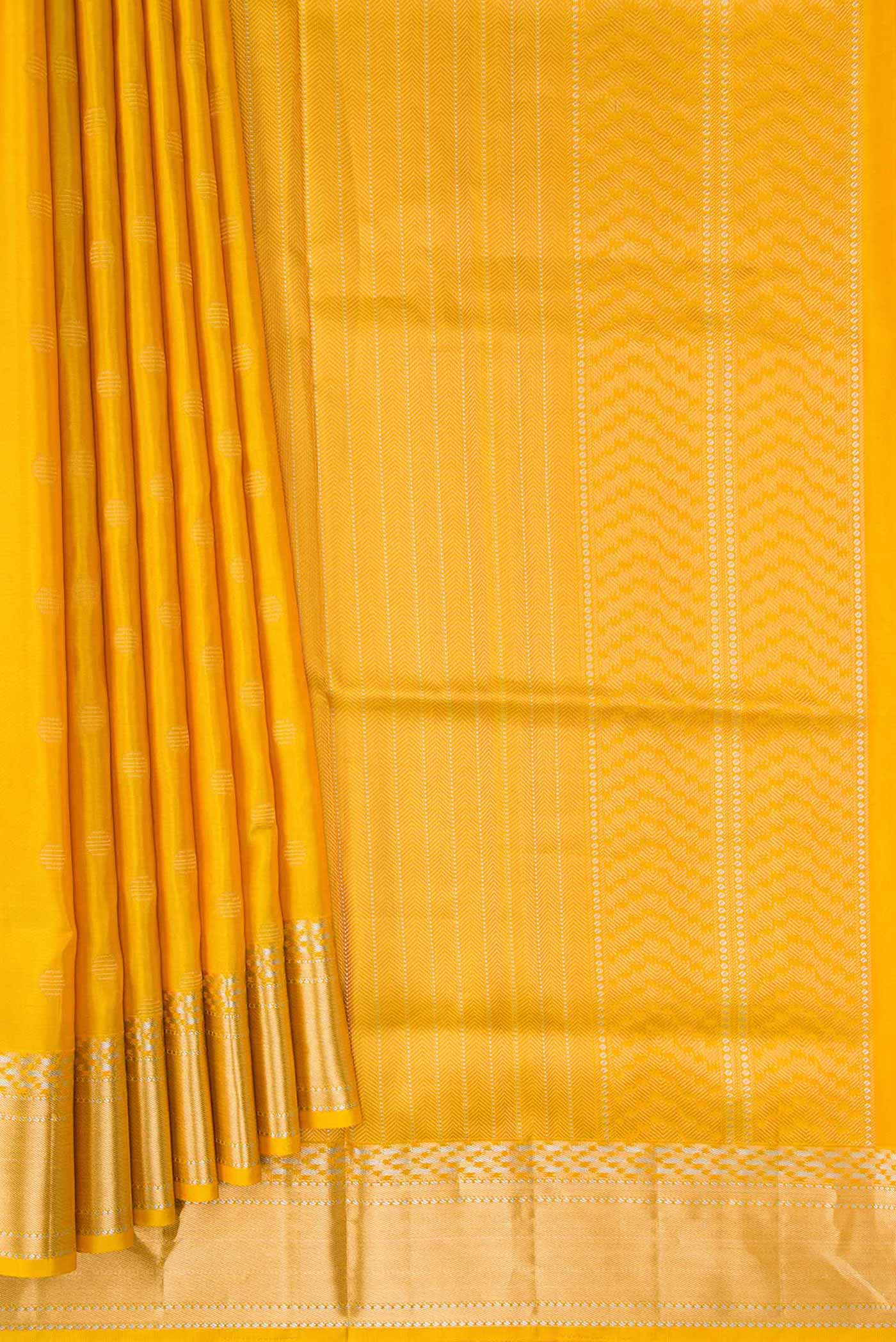 Pleats and pallu of Mustard Dual Tone Soft Silk Saree with Zari Butta on the body and Zari Border. 
