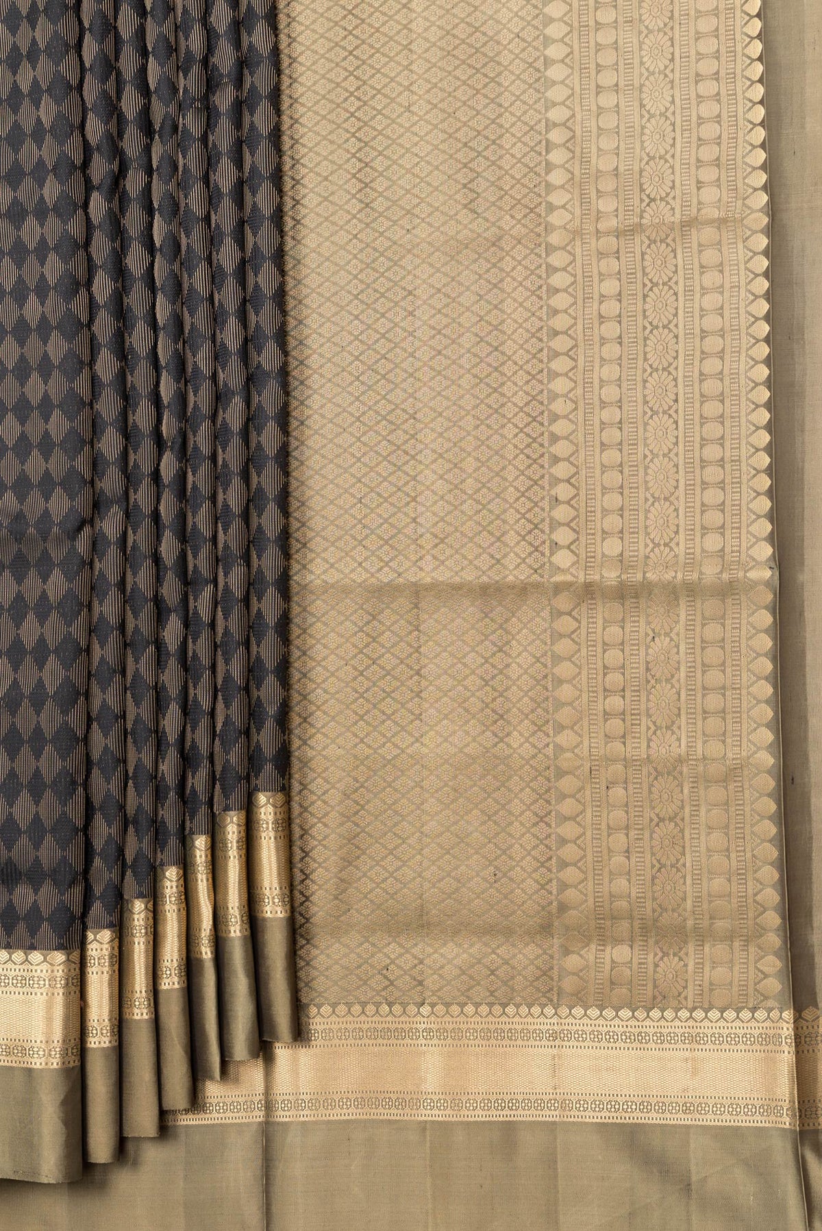 Pleats and pallu of Black Dual Tone Soft Silk Saree with Zari Brocade on the body and Zari Border. 