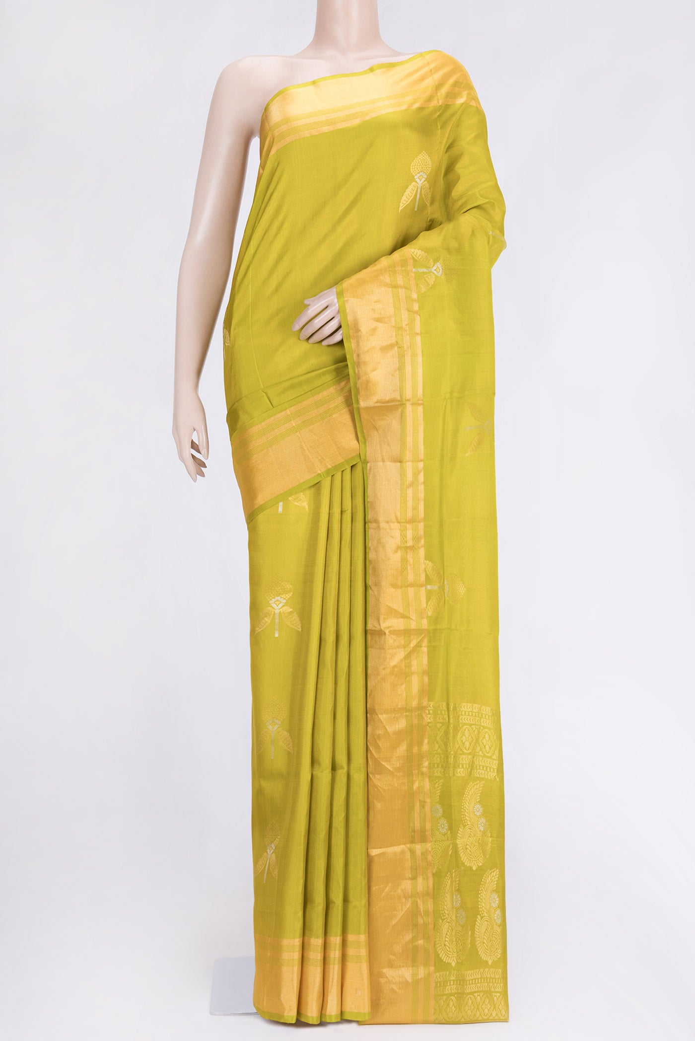 Parrot Green Dual Tone Soft Silk Saree with Zari Butta on the body and Zari Border.  displayed on a mannequin