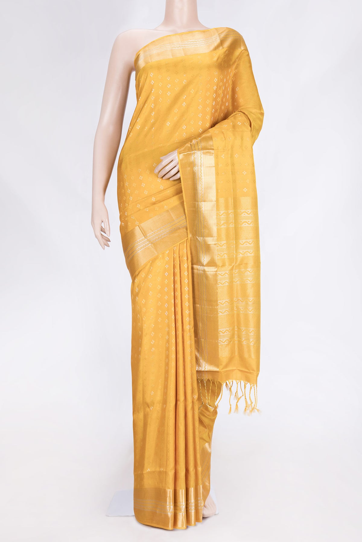 Mustard Dual Tone Soft Silk Saree with Zari Butta on the body and Zari Border.  displayed on a mannequin