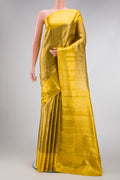 Gold Dual Tone Kanjivaram Tissue Silk Saree with Zari Brocade on the body and Zari Border.  displayed on a mannequin