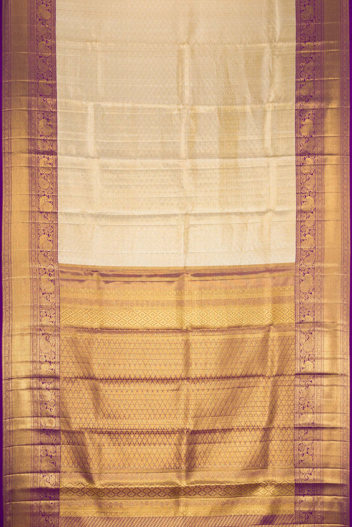 Flat view of Gold Dual Tone Kanjivaram Tissue Silk Saree with Zari Brocade on the body and Zari Border. 