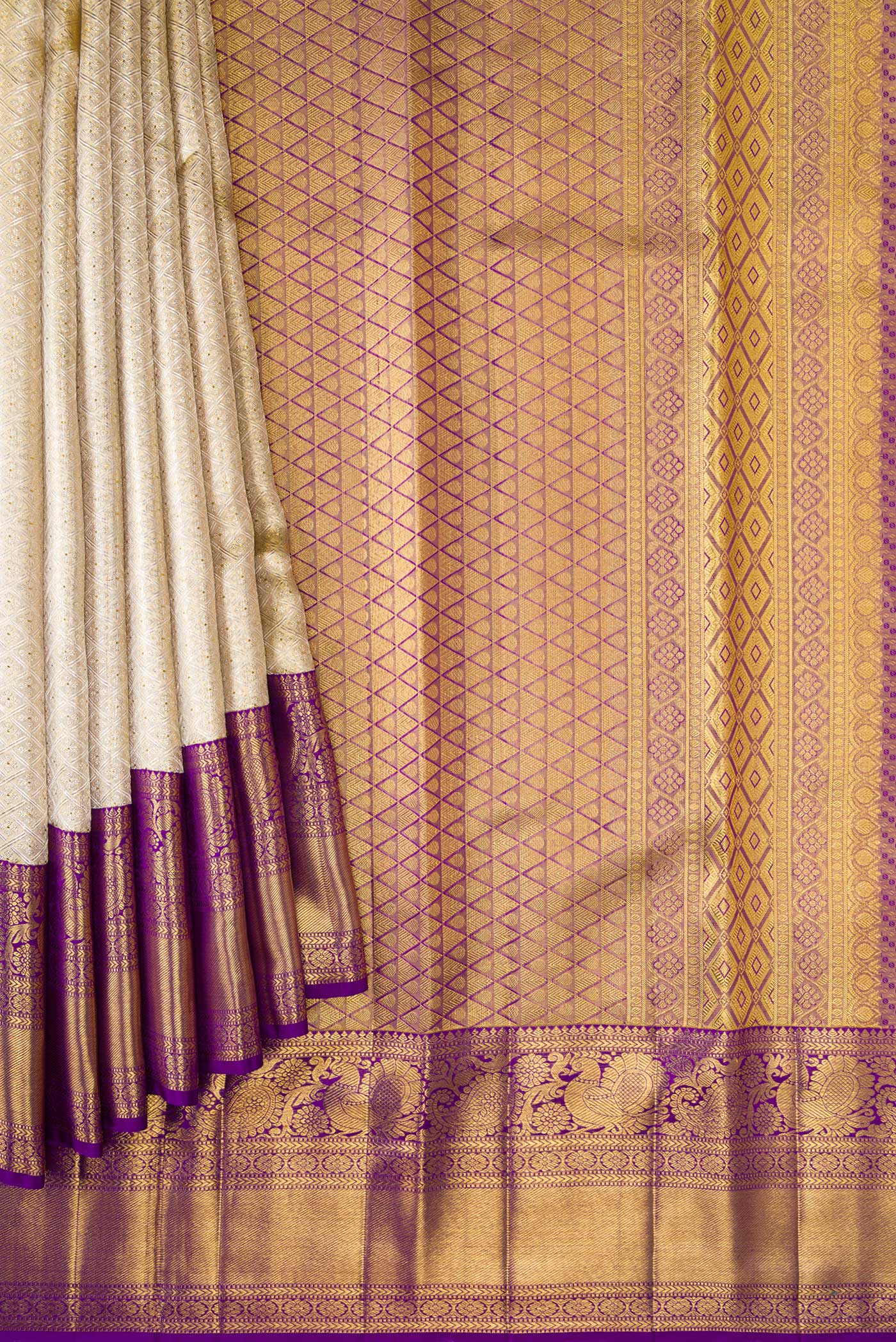 Pleats and pallu of Gold Dual Tone Kanjivaram Tissue Silk Saree with Zari Brocade on the body and Zari Border. 