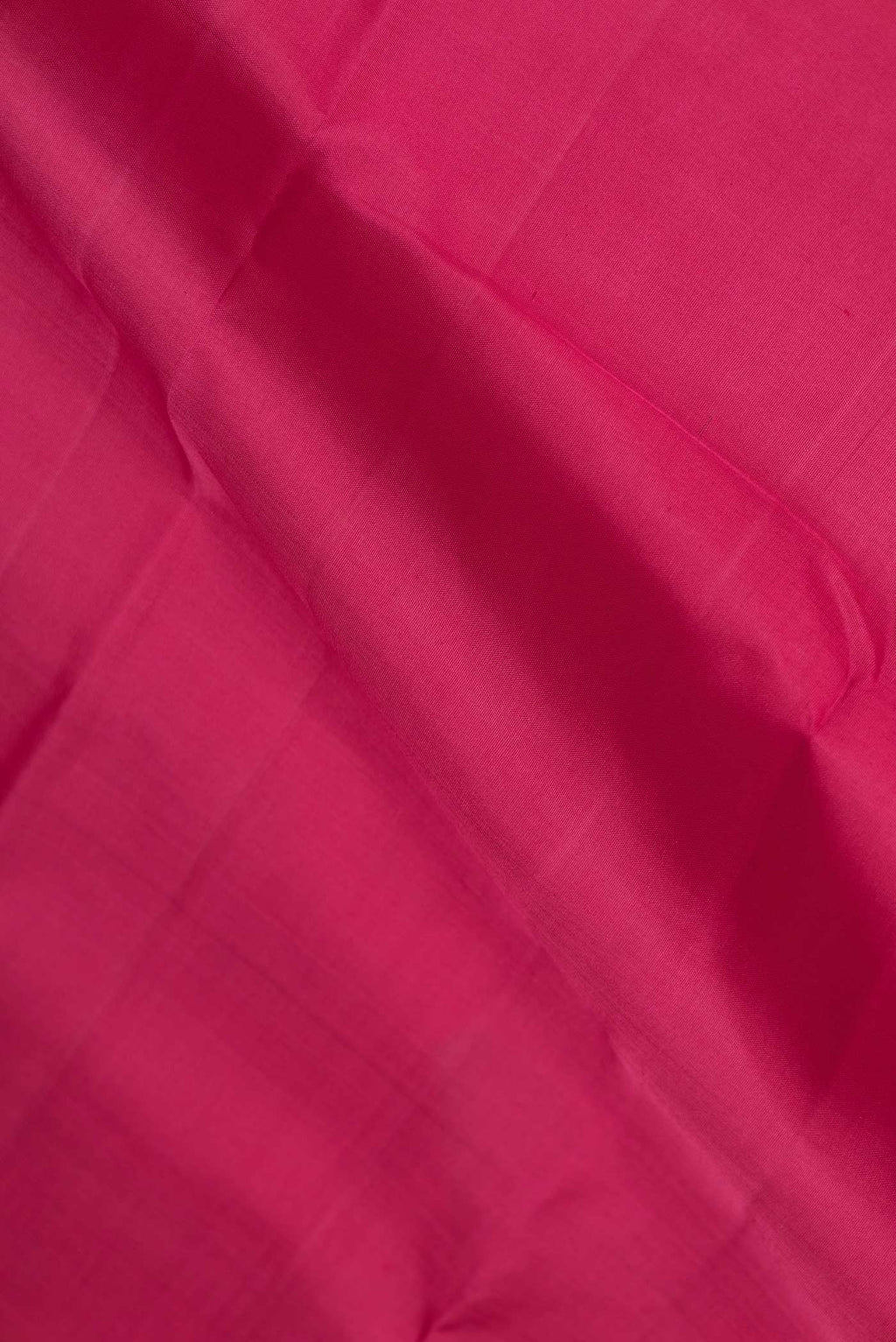 Close up of Pink Dual Tone Kanchipuram Silk Saree with Plain Body and Zari Border displaying folds