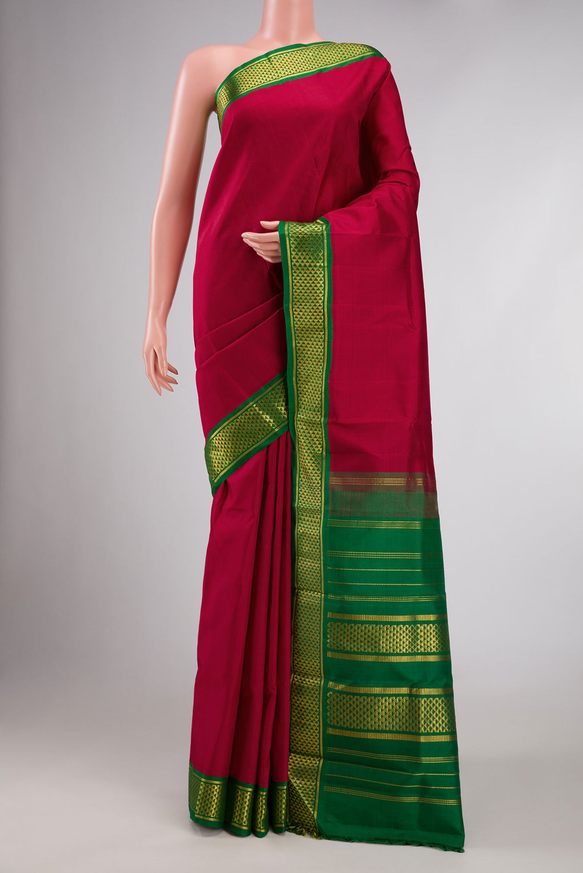 Maroon Dual Tone Kanchipuram Silk Saree with Plain Body and Zari Border displayed on a mannequin
