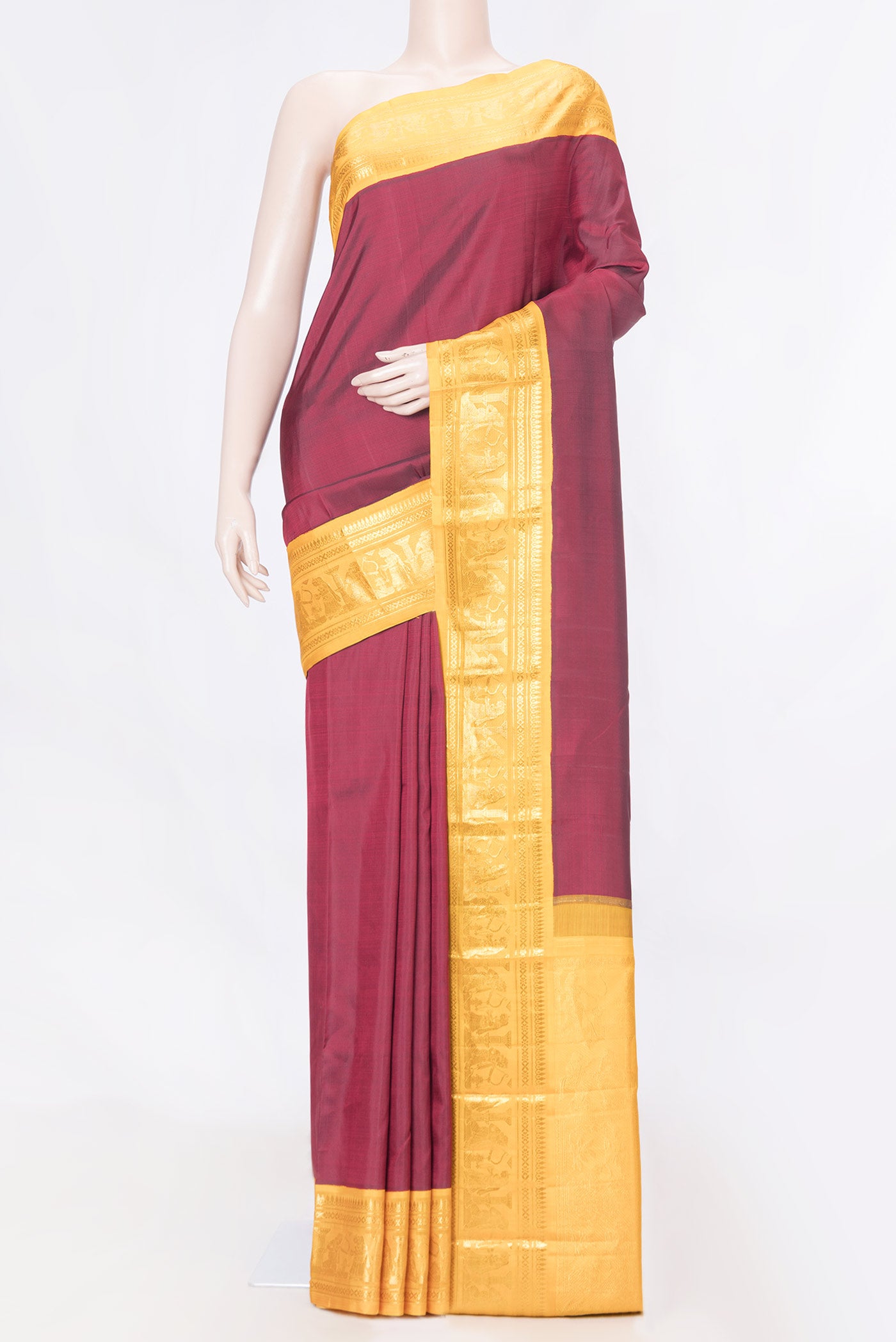 Pure Silk Pure Zari Maroon Dual Tone Kanchipuram Saree with Plain Body and Zari Border displayed on a mannequin
