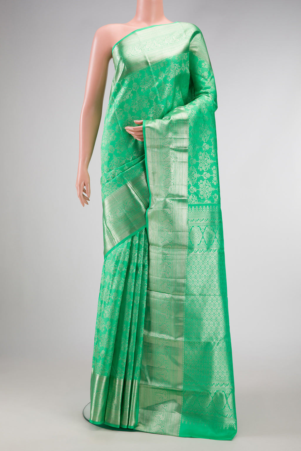 Parrot Green Dual Tone Kanjivaram Silk Saree with Zari Brocade on the body and Zari Border.  displayed on a mannequin