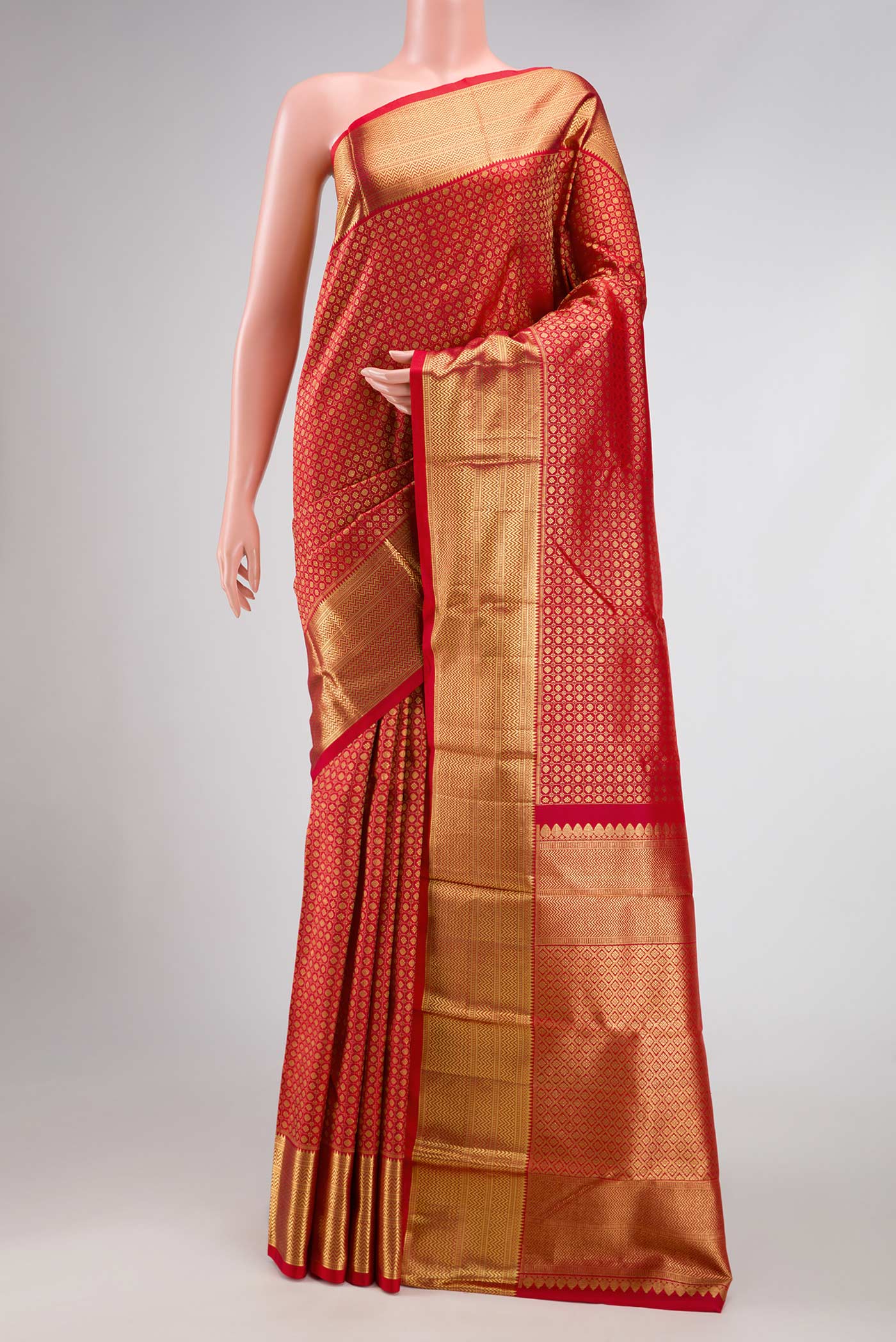Maroon Dual Tone Kanjivaram Silk Saree with Zari Brocade on the body and Zari Border.  displayed on a mannequin