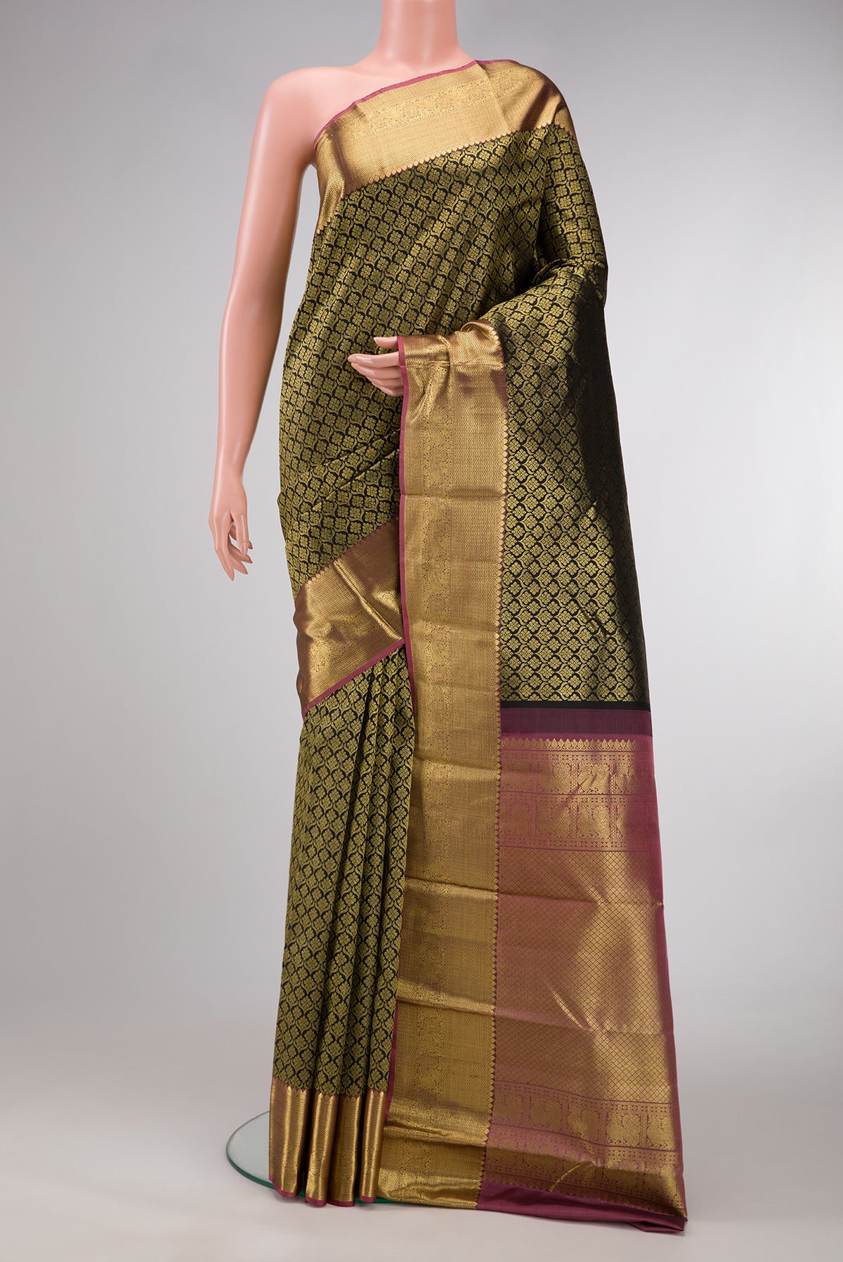 Black Dual Tone Kanjivaram Silk Saree with Zari Brocade on the body and Zari Border.  displayed on a mannequin