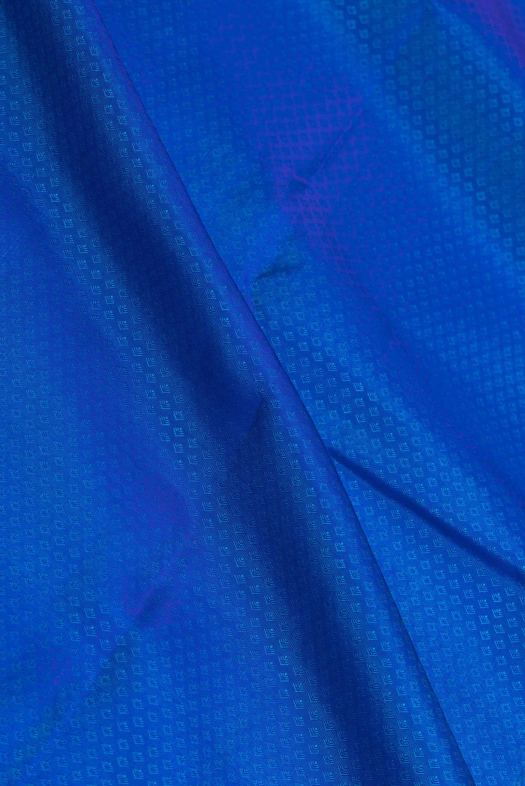Close up of Peacock Blue Dual Tone Kanchipuram Saree with Jacquard design on the body and Zari Border displaying folds
